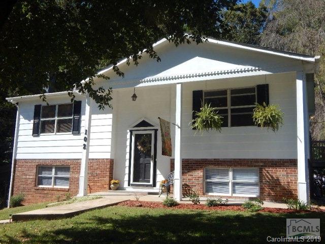 Impressive 3BR/1.5BA home's Exterior and Interior completely updated and refreshed.Nestled on a large level lot at the end of a quiet Cul-de-sac neighborhood. Home greets you with an open foyer and easy flow floorplan from the living room with a gas fireplace into the kitchen with an inviting deck off the dining area. An abundance of natural light flows throughtout the home. Appreciate the newly installed Mohawk Laminate Wood flooring, No Carpet around, decorator wall colors, Curtains and detailed fixtures. Three generous bedrooms each with own spacious closet and nicely finished full bathroom. Finished full basement will continue to impress you with an enormous amount of usable space for whatever your family needs. Remodeled half bath could easily be a full, huge 11x10 Laundry room, Wood stove atop a brick hearth, two separate walk out basement doors to an entertaining private back yard patio. Creek bordering the back of the property. Large DBL Detached Carport and Outbuilding. One Ye