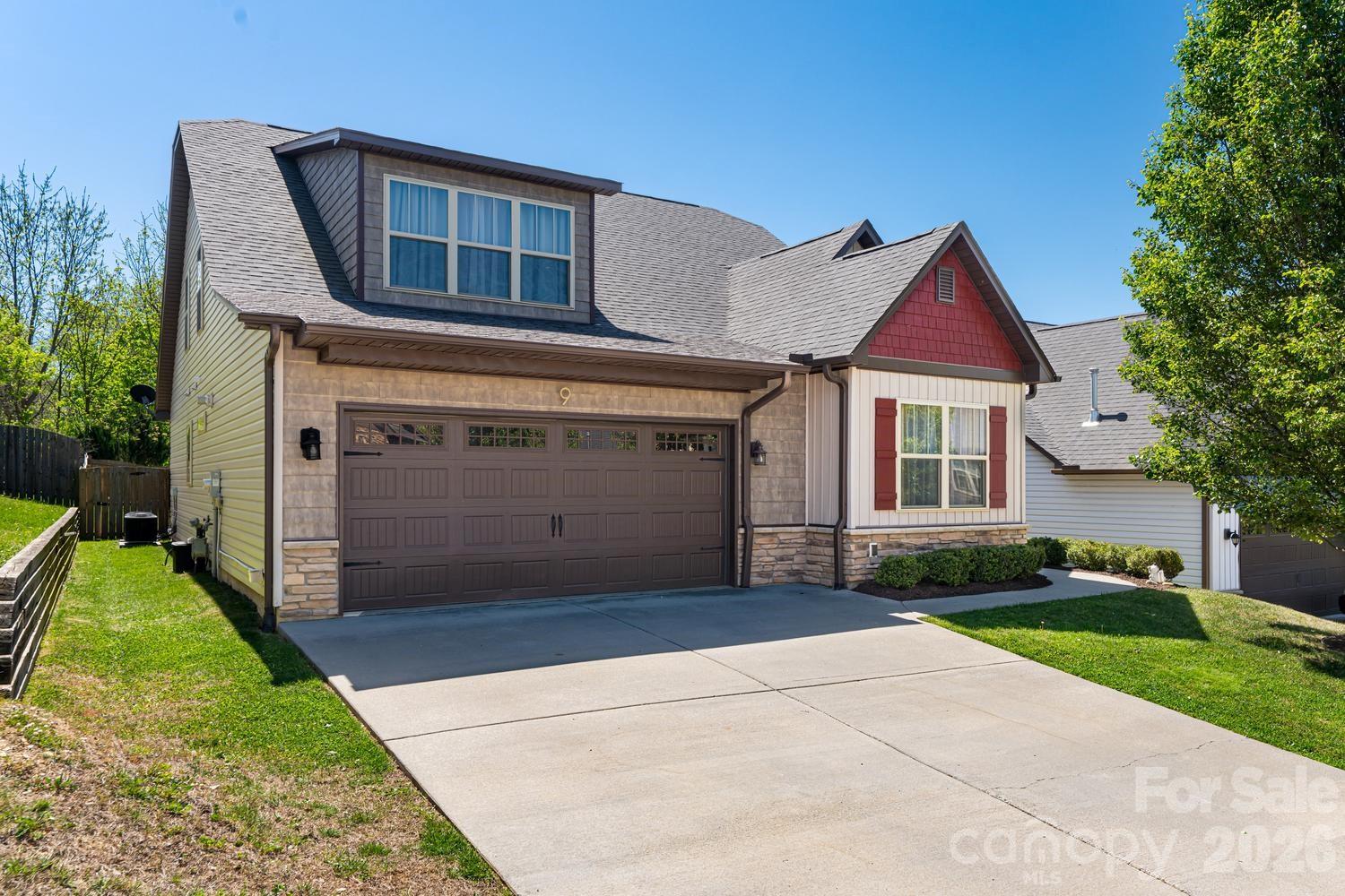 Exceptional value in desirable Weaverville. This well-maintained Arts & Crafts home offers the space, flexibility, and outdoor living today's buyers are searching for.

Filled with natural light, the open-concept floor plan features coffered ceilings, large windows, and a welcoming living room centered around a gas fireplace. The kitchen is designed for both everyday living and entertaining, offering newer black stainless-steel appliances, a walk-in pantry, abundant workspace, and seamless connection to the dining and living areas.

The main-level primary suite provides convenience and privacy with a walk-in closet and en-suite bath, while three additional bedrooms and a spacious upstairs family room offer flexibility for guests, remote work, hobbies, fitness, or a second living area.

Step outside to enjoy a screened porch, expansive patio, and fully fenced, level backyard; ideal for pets, play, gardening, and outdoor gatherings. Additional features include a two-car garage, gas generator hookup, generous storage, and a large laundry room with utility sink.

Located directly across from Karpen Field and its trails, near Reems Creek, and just minutes from downtown Weaverville's restaurants, local shops, breweries, and year-round community events. Downtown Asheville is approximately 10 miles away, providing easy access to all that Western North Carolina has to offer.

Combining 4 bedrooms, 3 full baths, a primary suite on the main level, flexible living spaces, and a level fenced yard, this thoughtfully designed home presents a rare opportunity in one of Weaverville's most convenient locations. Priced to reflect today's market and offering outstanding value for size, condition, and location.