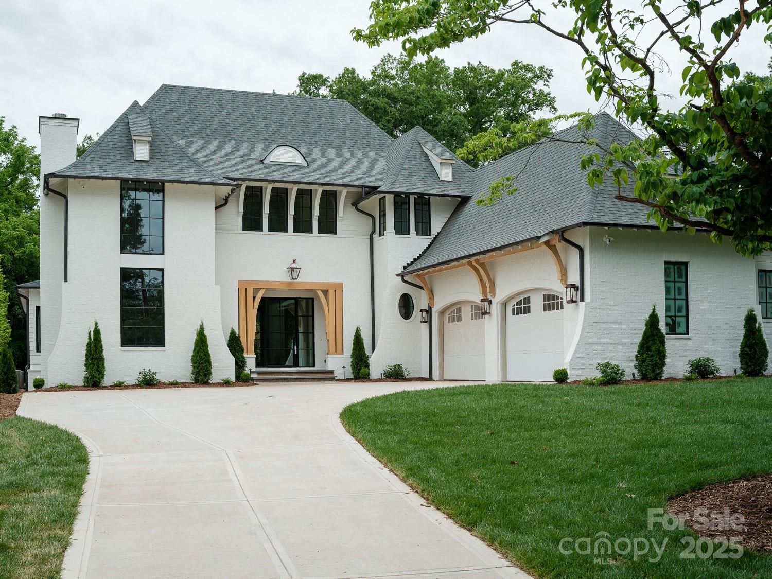 This stunning Sixteen Penny new construction home offers 5433 SQFT of luxurious living space, designed for comfort & style. Located on a quiet street in MP, it features a 2-car garage & designer finishes throughout. The main level includes a spacious primary suite w/ custom cabinetry, marble countertops w/ a waterfall feature, dual vanities, separate closets, & large skylight above the walk-in shower that floods the bathroom w/ natural light. The open-concept living area boasts 12 ft ceilings, w/ a chef’s kitchen featuring Sub-Zero & Wolf appliances, Quartzite countertops, & a matching backsplash. Bar seating at the island is perfect for casual dining & entertaining. This home also offers 5 add'l beds & baths. The 10 ft ceilings & hardwood floors throughout create an airy atmosphere. The back porch includes prewiring for surround sound, wood burning FP, screens, outdoor heaters, & a gas line for grilling. With a private backyard and top-tier finishes, this home is a true masterpiece.