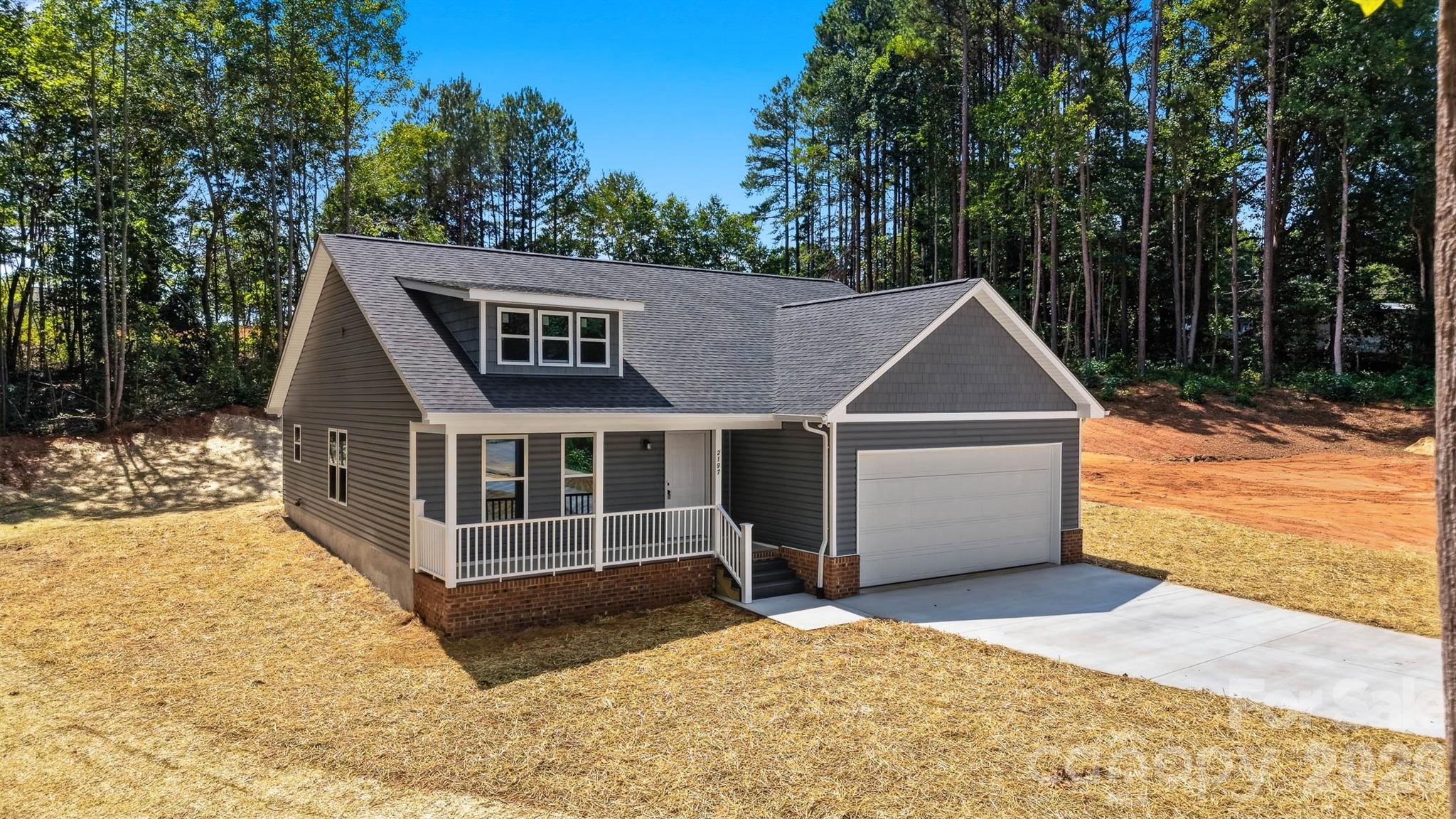 Welcome to this beautifully crafted new construction home nestled on nearly an acre in the established Cold Water Creek subdivision of Conover. Situated on a quiet cul-de-sac lot, this thoughtfully designed 3-bedroom, 2-bath home offers 1,405 heated square feet of comfortable living space along with an attached two-car garage.

Step inside to discover an open and inviting floor plan featuring durable luxury vinyl plank flooring, granite countertops, and quality finishes throughout. The spacious kitchen flows seamlessly into the main living area, creating the perfect setting for everyday living and entertaining. The private primary suite offers comfort and functionality, while two additional bedrooms provide flexibility for family, guests, or a home office.

Enjoy the peaceful surroundings from the covered front porch and take advantage of the expansive 0.95-acre lot, offering plenty of room to enjoy the outdoors. Located within the desirable Cold Water Creek community, this home combines the benefits of new construction with the charm and stability of an established neighborhood with protective covenants.

Conveniently located just minutes from Interstate 40, NC Highway 16, and the amenities of downtown Conover and Newton, this home offers an ideal location for commuters traveling to the Hickory and Charlotte areas while still providing the privacy and space you've been searching for.