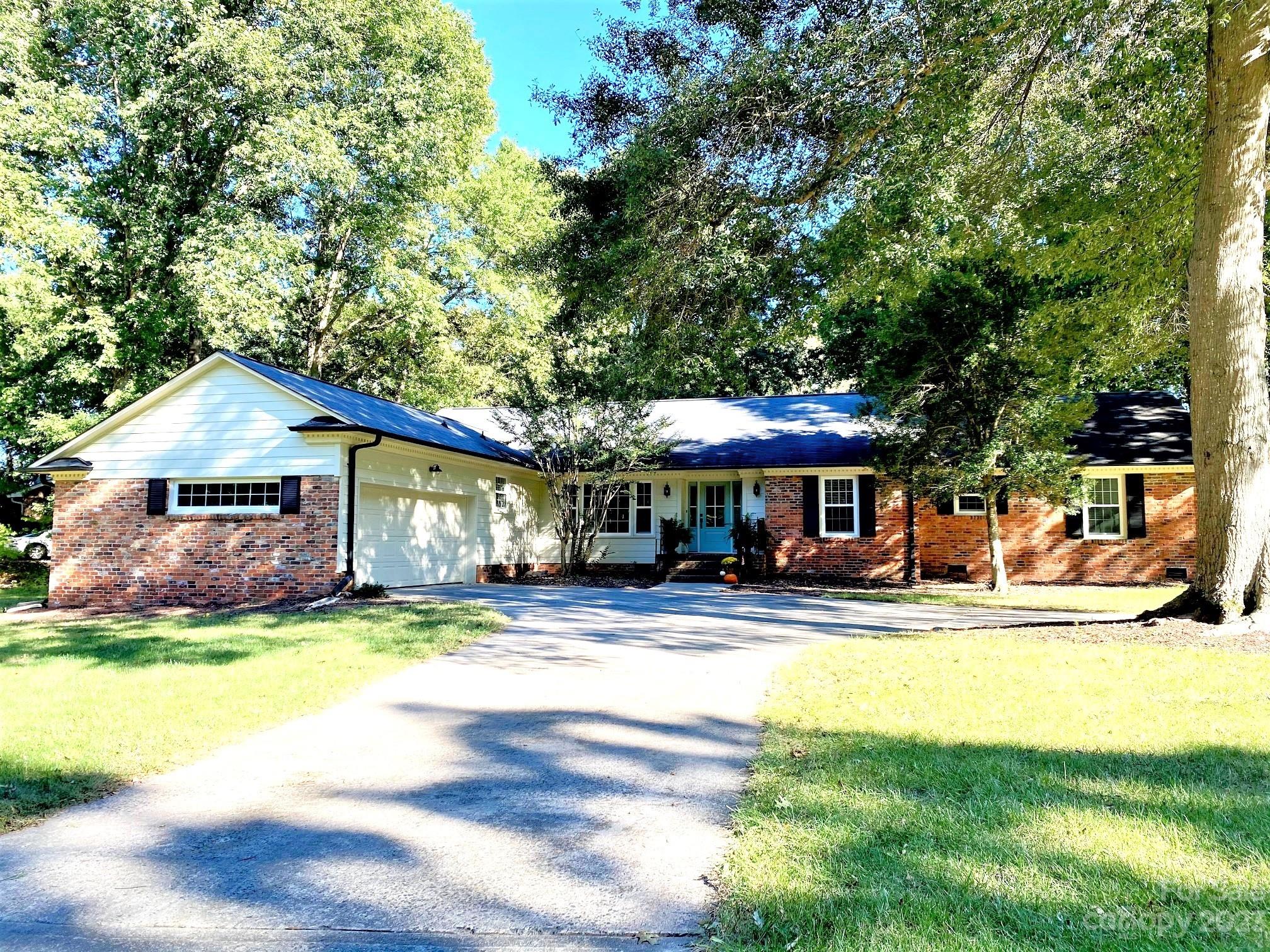 Welcome to this charming brick ranch home in Coulwood Hills! Property is situated on a beautiful half-acre lot and tastefully renovated paying homage to the home's original details. The entry way welcomes you into dedicated dining space adjacent to spacious living room, overlooking backyard with patio. Attached cozy den functions great as a home office or playroom. Chef’s kitchen was completed in 2020 and features SS gas range, soft close cabinetry, granite countertops and walk-in pantry. Down the main hall you’ll find 3 nicely sized bedrooms and shared hall bath. Owners suite is complete with his and her closets, spacious vanity area and updated bathroom.

Seller takes pride in ownership and has made notable additions such as replacement windows and entry doors, Hardie Plank siding, hardwood laminate flooring, and designer lighting. Voluntary Neighborhood council has park, community pool, and social events throughout the year. Minutes to all major highways, airport, and uptown!