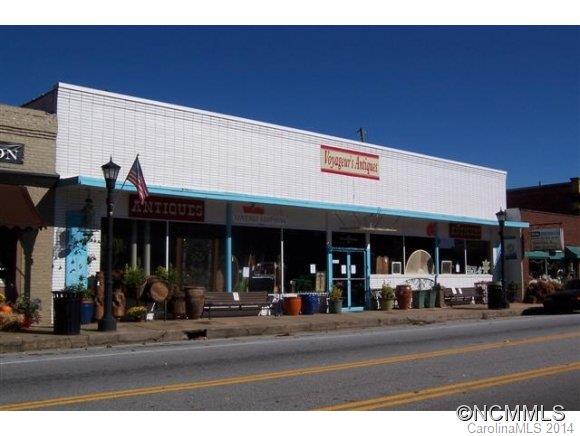 Very high profile building on main street HY14 Landrum, SC. with 6,594 square feet of usable space. The main floor is 2,705 sq ft,lower level is 1,590 sq ft,and upper level is 1,678 sq ft with an additional 621 sq ft for storage. Public entrance off main street through double doors,and back door access is off of Sunset St. Loading bay entrance is  off of Sunset St.All usable space is open and may be used for multiple purposes. 3 zone HVAC.
