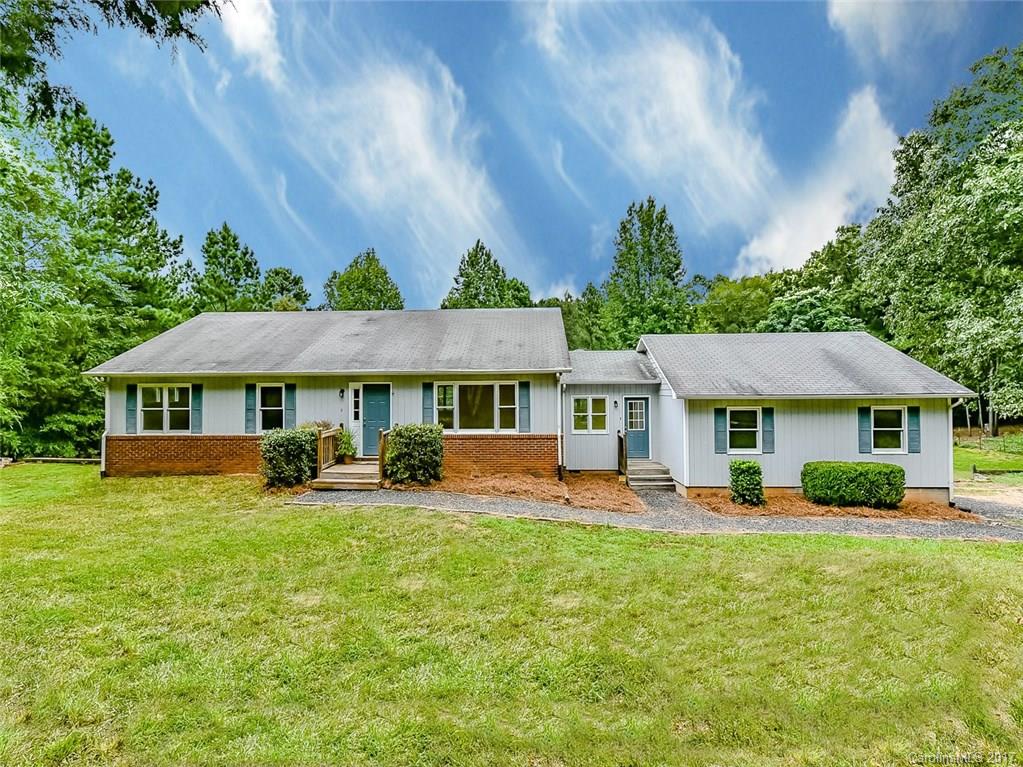 Rare, BEAUTIFUL property located 15 minutes off of I-77, and only 18 minutes from Dave Lyle Blvd shopping. Experience Country Living at it's finest on this private, 5 acre lot. Interior walls, kitchen & bathroom vanity cabinets are freshly painted. New fixtures in the kitchen & dining area. Large mudroom off of the 2 car garage. Walkout basement gives the potential to nearly double its HLA or use for endless storage. Even more storage can be found under the massive pole barn in the backyard.