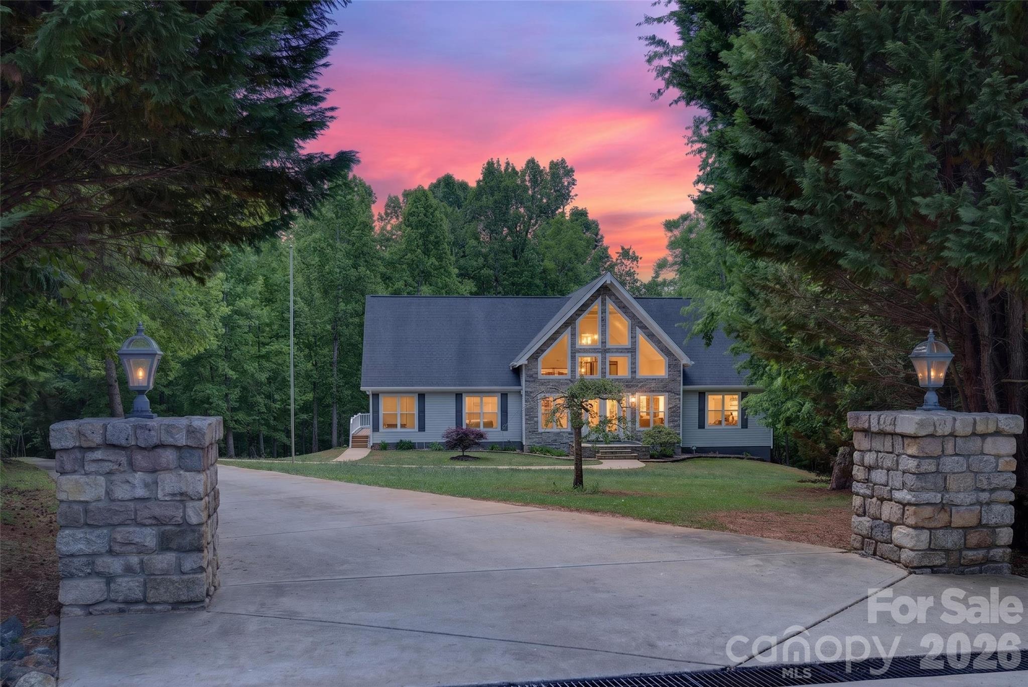 Tucked away on nearly 3 private acres, this one-of-a-kind property offers the feeling of a mountain retreat. Surrounded by nature and complete privacy at the end of a cul-de-sac, this 3 Bedroom, Loft + Bonus Room home delivers the perfect blend of peaceful living and everyday convenience. Inside this STUNNING entrance, gleaming hardwood floors, vaulted ceilings, and an inviting open layout create a warm and welcoming atmosphere and functioning main-level living. The kitchen features upscale custom cabinetry, granite countertops, stainless steel appliances and excellent flow for entertaining and daily living. Outdoor living shines with a spacious screened porch and expansive 40' x 12' deck overlooking the serene wooded yard, ideal for relaxing and enjoying the sights and sounds of nature year-round. Raised planting beds, some fruit trees and even a treehouse are a homesteading dream. The basement and garage are definitely a stand-out feature offering over 2200 sft, plus a full bathroom with walk-in shower, flexibility for work shops, recreation, home gym, hobbies, work-from-home business owners and auto enthusiasts or simply open those garage doors for open air entertaining. Garage floors are plumbed with hydronic radiant floor tubing system. Just outside, designated hot and cold spigots with dedicated wiring ready for your Hot Tub and a whole-home generator.  Additional highlights include dedicated RV parking with power hookup just off the concrete driveway.  A setting that truly feels like a private mountain getaway without sacrificing access to shopping, dining, and major highways because Sherrills Ford, Claremont, Newton, Conover, Statesville and Hickory are all near. NO HOA, NO City taxes make this Move-In Ready Home a rare find!