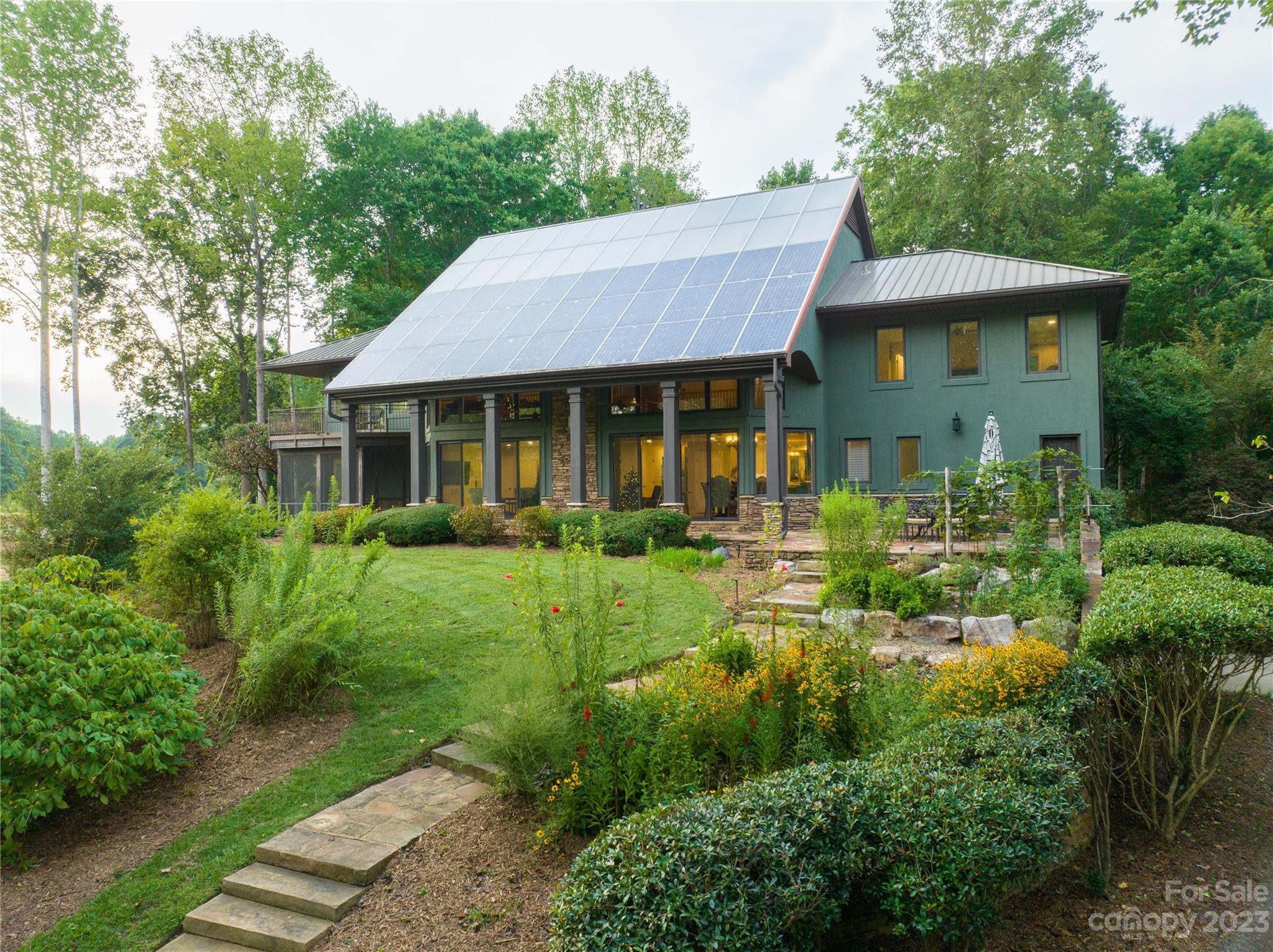 One of the kind of property! 400' LKN waterfront offers over 8a of land and 8a your own private pond. 2 separate entry ways greet you by your private gate and national park like landscapes displaying many rock swells, water stream, nature rock pond, walkways with bridges, and lots more. LKN cove dredged 400' and 150' rip raped with floating dock. Fully remodeled 5 bedroom, 7 bath home showcases surrounding nature and pond via many casement windows. Beautiful open concept floorplan with kitchen stocked with SSA, 2 dishwashers, double ovens, built in refrigerator, large island, walk in pantry, 2 story open dining room and living area. Primary bedroom w/entry rooms/her/his closets & fabulous bath! All levels have radiant floor solar heating and geo thermal cooling in addition to save energy. Fantastic location with the feel of privacy and nature you will not find anywhere. The listing agent is the owner. Close to shops, restaurants, medical, all you need. Potential to build 6+ more homes.