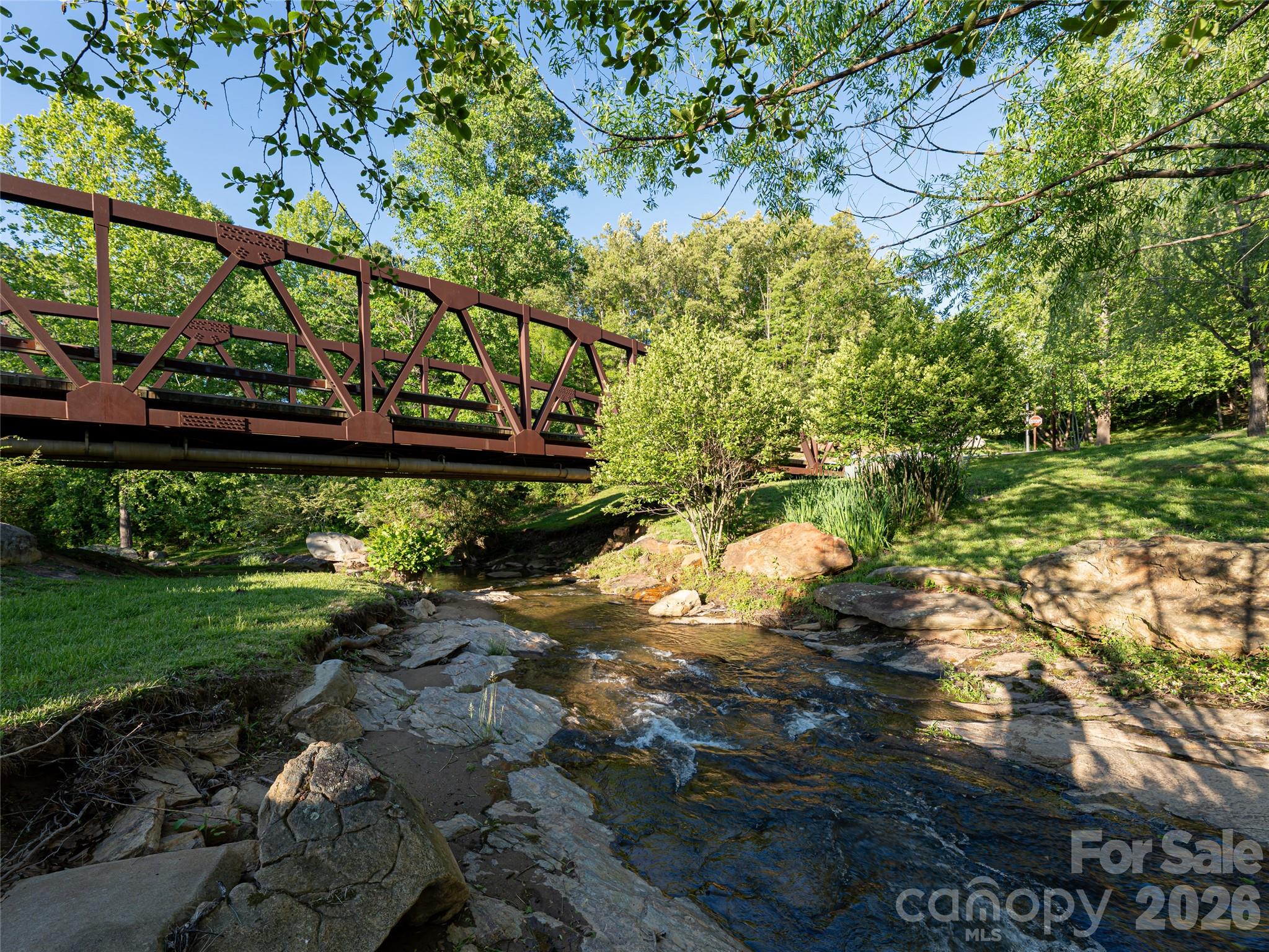 Experience life in Olivette—an award-winning agrihood along the French Broad River, just 12 minutes (under 7 miles) from downtown Asheville and featured in Martha Stewart Living as “the neighborhood of our dreams.” 124 Lilikoi Lane is tucked at the end of a peaceful cul-de-sac, offering 1.25 gently sloping acres ready for your custom build. With city water, sewer, underground utilities, and high-speed fiber internet, you’ll enjoy modern convenience in a setting designed to connect you to nature and community. Daily life here moves at a different pace. Step outside to walk wooded trails, spend time by the river, or visit the on-site organic farm. Whether you’re relaxing at home, meeting neighbors at a gathering space, or enjoying the outdoors, Olivette offers a balance of privacy, connection, and simplicity—just minutes from everything Asheville has to offer.