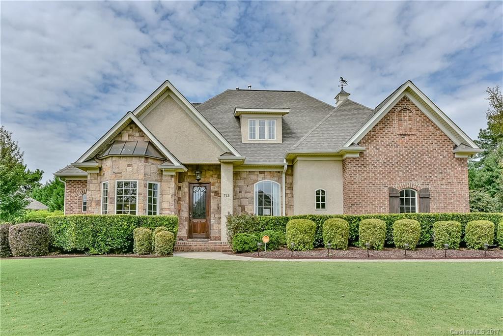 JUST REDUCED!! Gorgeous, custom built, full brick home with side load garage on level, fenced lot. 4 bedrooms 3.5 baths, main floor master suite, 4th bedroom en suite, office with stained glass doors, oversized screened porch, theater room, 10’ ceilings, 8’ doors, granite counters, stainless appl, site finished hardwood floors, custom moldings throughout. New roof, encapsulated crawl space w/ dehumidifier and sump pump. In-ground basketball hoop & hot tub pad with electrical. Close to 77 and 485