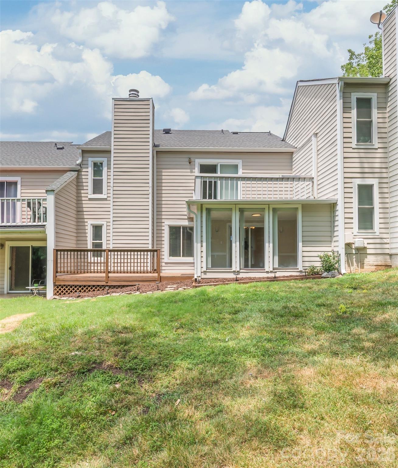 Fall in love with this move-in-ready townhouse, perfectly situated in one of the region’s most sought-after neighborhoods. The unbeatable location places you within a half-mile stroll of premier dining and shopping, while offering an effortless commute to Uptown Charlotte and Matthews. Inside, hardwood floors guide you through a bright, spacious layout. The heart of the home is the remodeled kitchen, boasting sleek quartz countertops, a classic subway tile backsplash, stainless steel appliances, and modern hardware.
The bathrooms have been tastefully modernized with stylish new vanities, tile work, and contemporary fixtures. Storage is remarkably abundant, featuring dual walk-in closets in the primary suite and a dedicated exterior storage room. Fresh paint fills the living and dining room with light, leading you toward the serene sunroom. From there, step out onto the lovely wood deck—perfect for effortless entertaining. With a new HVAC (2022), Roof (2024), and water heater (2023), you can enjoy peace of mind. Best of all, your back door opens directly to an expansive, scenic common area with a seasonal view of Cricket Lake.