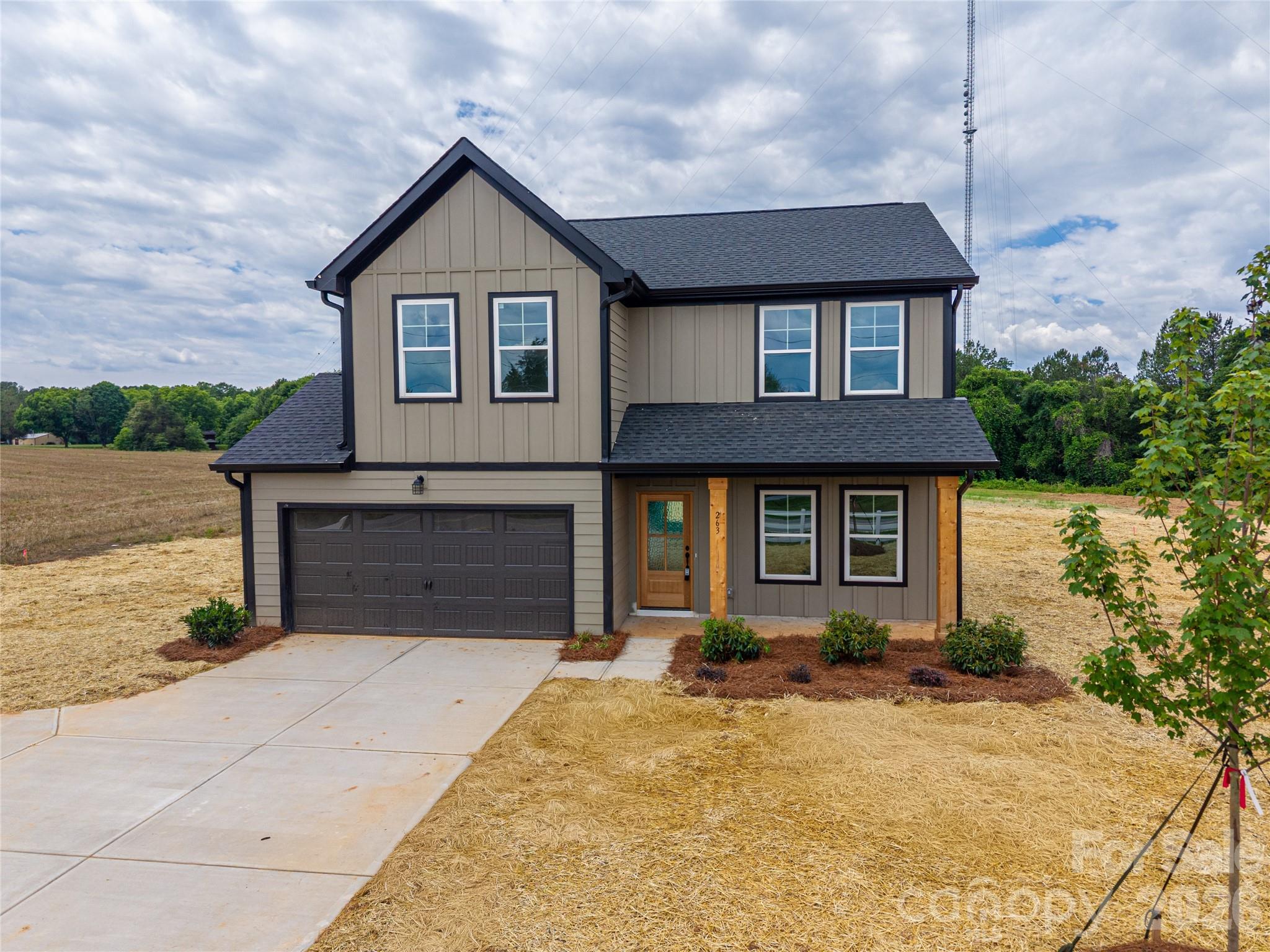 Welcome home to this beautifully crafted property in the heart of Dallas, NC, offering the perfect blend of modern finishes and everyday functionality—without the restrictions of an HOA. Situated on a generous 0.92-acre lot, this home provides space, privacy, and curb appeal from the moment you arrive. A welcoming front porch with cedar columns and a stunning mahogany front door sets the tone for the quality you’ll find throughout. Inside, the main level features durable laminate flooring and a versatile flex space—perfect for a home office or playroom. The kitchen is designed to impress with quartz countertops, a stylish tile backsplash, stainless steel appliances (dishwasher, range, and over-the-range microwave), and sleek black plumbing and lighting fixtures that tie it all together. Upstairs, you’ll find four spacious bedrooms with comfortable carpet, while both full bathrooms showcase quartz countertops and tile flooring. The primary suite offers a beautifully finished tile shower, creating a clean, upscale retreat. Additional highlights include laminate stairs, tile flooring in the bathrooms and laundry room, and low-maintenance fiber cement siding for long-term durability. **Preferred lender offers up to 1% in buyer credit**