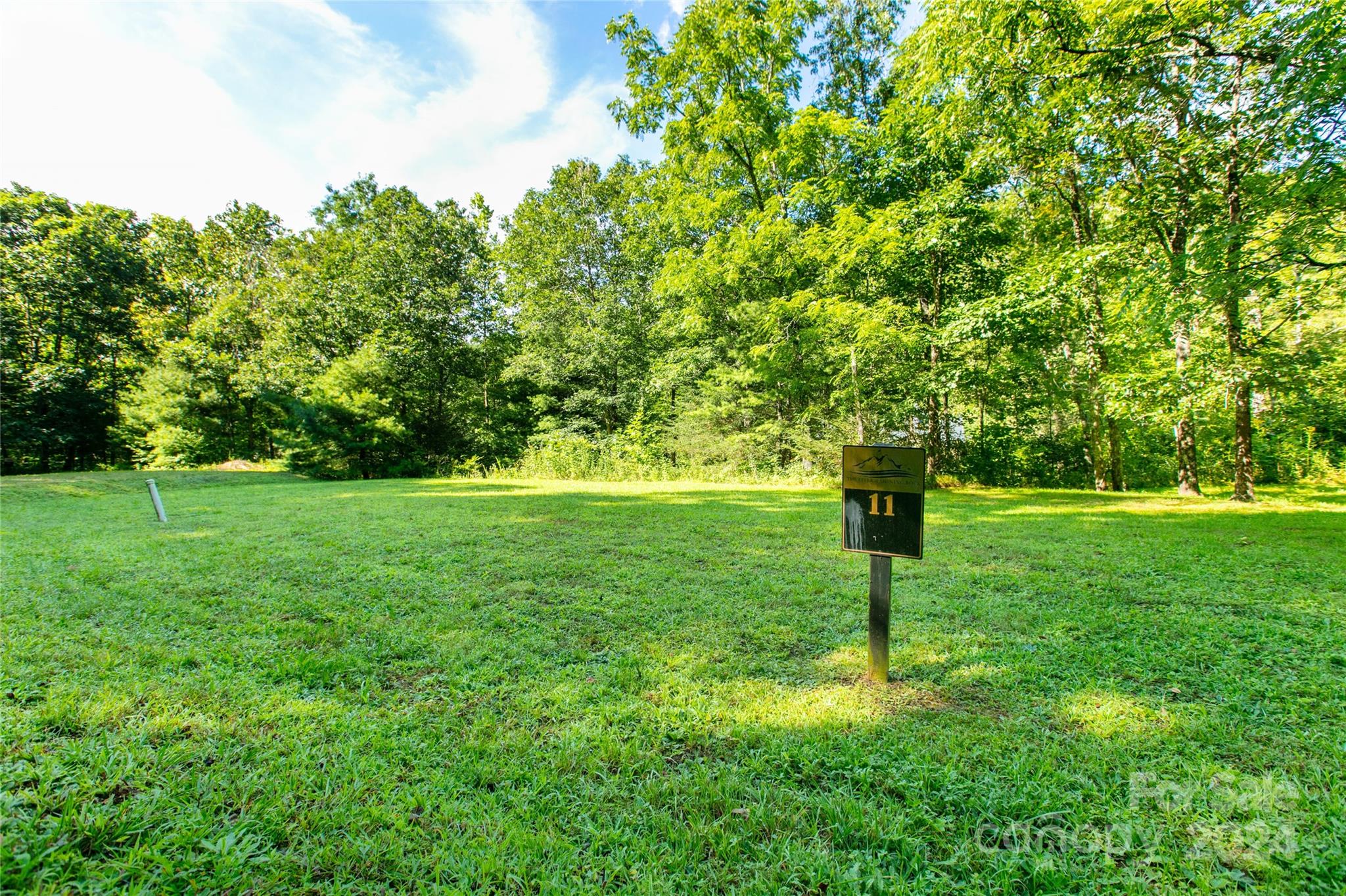 Ready to Build Your Mountain Retreat by the River? Discover a well-maintained and near-level community—a rare gem in the mountains! Immerse yourself in the soothing sounds of water cascading over river rocks, set against the breathtaking backdrop of the national forest and Camp Daniel Boone. Enjoy convenient access to the Blue Ridge Parkway, renowned trout waters perfect for fly fishing, and the locally beloved Sunburst Trout Farm. Whether you're seeking tranquility or adventure, this location offers the best of both worlds.