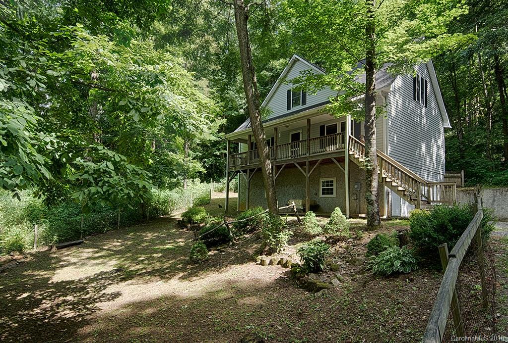 Walk through the spacious wood fenced yard to the entrance with slate accent steps and native stone fireplace. Every room has a splash of charm to enhance the well being of its owners,friends and family - not ordinary as you may think, well laid out space for a 3 bedroom with oversize garage/workshop, two decks,wood/tile floors. More wood/granite in the kitchen with a drop-in sink, two color cabinets and Cafe dining room. This home is so pleasing you have to step inside to feel the peacefulness.