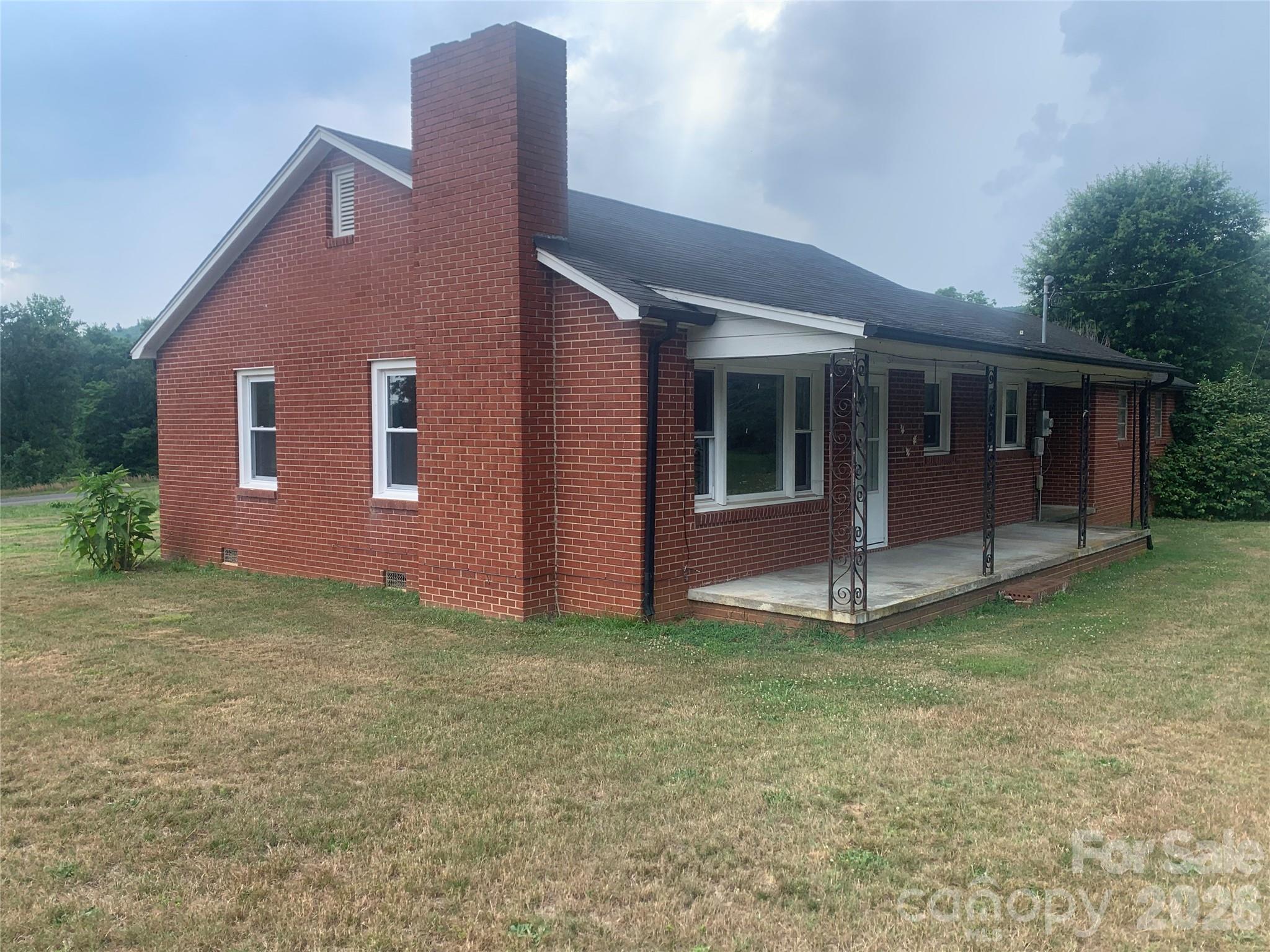 This single-family home offers an inviting blend of vintage character and country convenience along scenic NC Highway 16 North. Built in 1945, this compact brick ranch-style house sits on approximately 1.61 acres, providing plenty of outdoor space for gardening, outdoor activities, or future expansion in desirable Alexander County. Inside, approximately 965 square feet of living space features 2 bedrooms and 1 bathroom. The layout is efficient and functional, ideal for first-time buyers, downsizers, or anyone seeking room to personalize. 
Key Features: Built in 1945, 2 Beds, 1 Bath, 965 Sq Ft, 2-car garage, 1.6-acre lot with highway frontage for easy access. Convenient location near Taylorsville amenities, schools (Alexander Central district), and local attractions
Whether you're looking for an affordable starter home, a weekend getaway, or an investment property with potential, this Alexander County gem delivers classic North Carolina appeal in a peaceful setting. Current survey showing the property divided. Owners would like to sell the property all together with MLS#4402655, see combined listing MLS#4402704.
