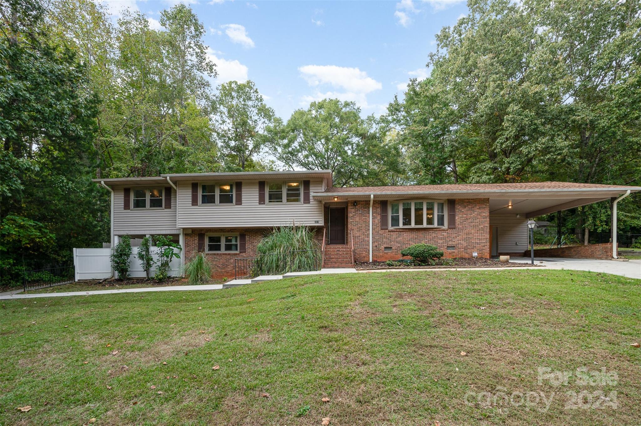 Classic Split level home in the heart of Lancaster awaiting you to put your touch on it.  Main level has a large living room/dining room that flows into the kitchen.  A large screened porch is off the kitchen that gives you access to the backyard.  The upper level has three bedrooms, including the primary, and a large Sunroom/bonus room that has large picture windows overlooking the in-ground pool. Lower level has a large living room and one more bedroom.  From the living room, you can step out to your covered patio that also has pool access.