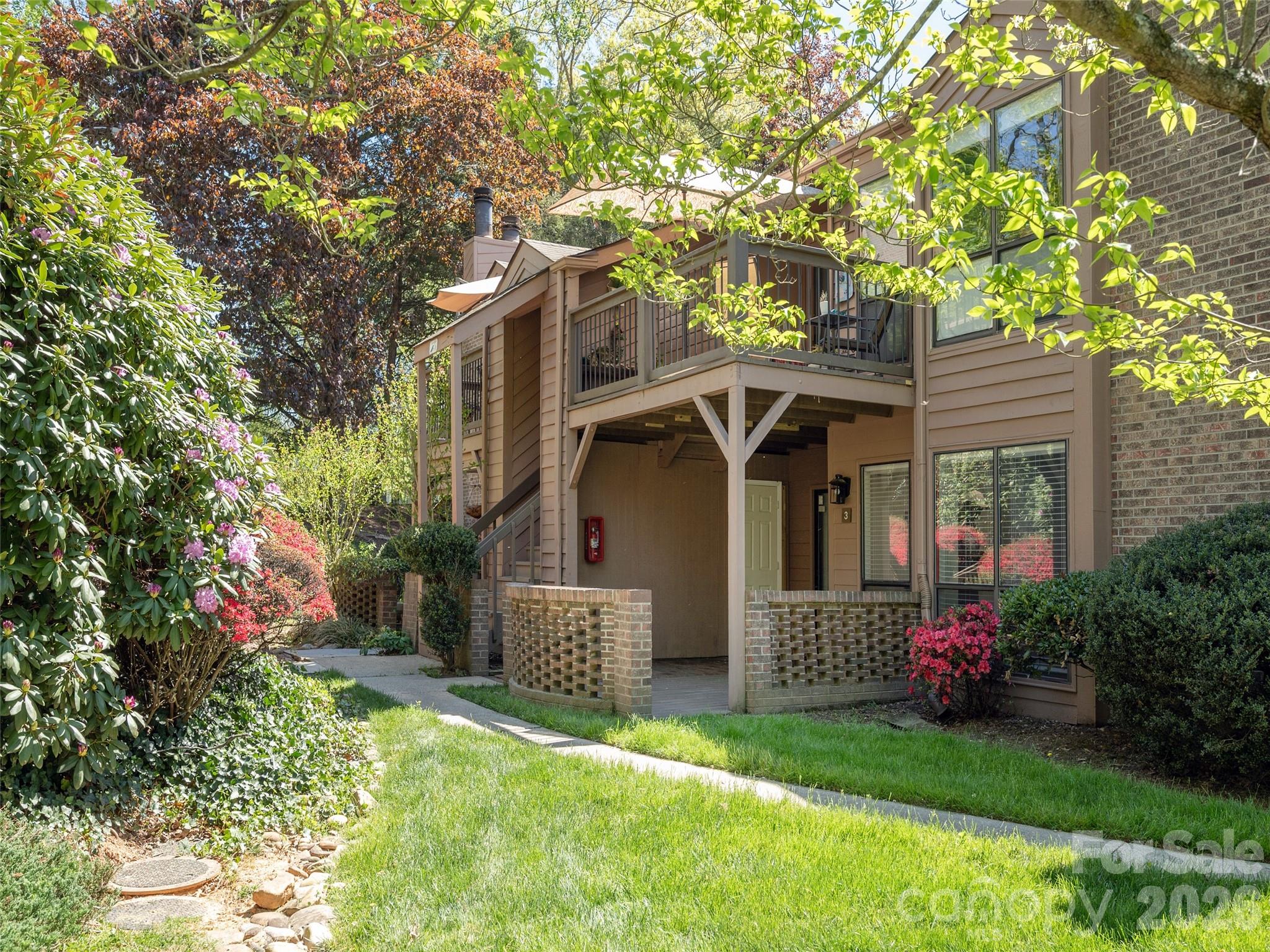 Discover convenient main-level access living in an updated 2BR/2BA condominium home. Located in South Asheville with access to Downtown Asheville, Hendersonville, Inter-state I-26 and the Asheville Airport. Open floorplan, with white-washed brick facade fireplace in spacious living room, dining area and kitchen and two bedrooms with each having their own full baths. Condo has a refreshed interior featuring newer flooring, a beautifully remodeled primary bathroom with nice step-in Shower, tile and counters, updated paint throughout. Home has had Newer HVAC (2019), new Water Heater, newer appliances including an over/under washer/dryer unit in the Laundry on the Main. Owner has had plumbing, electric and HVAC recently checked prior to listing for sale. With its clean, turnkey possible and thoughtful updates, this home is ready for you to move in and enjoy. Owner may consider including some or all furnishings.