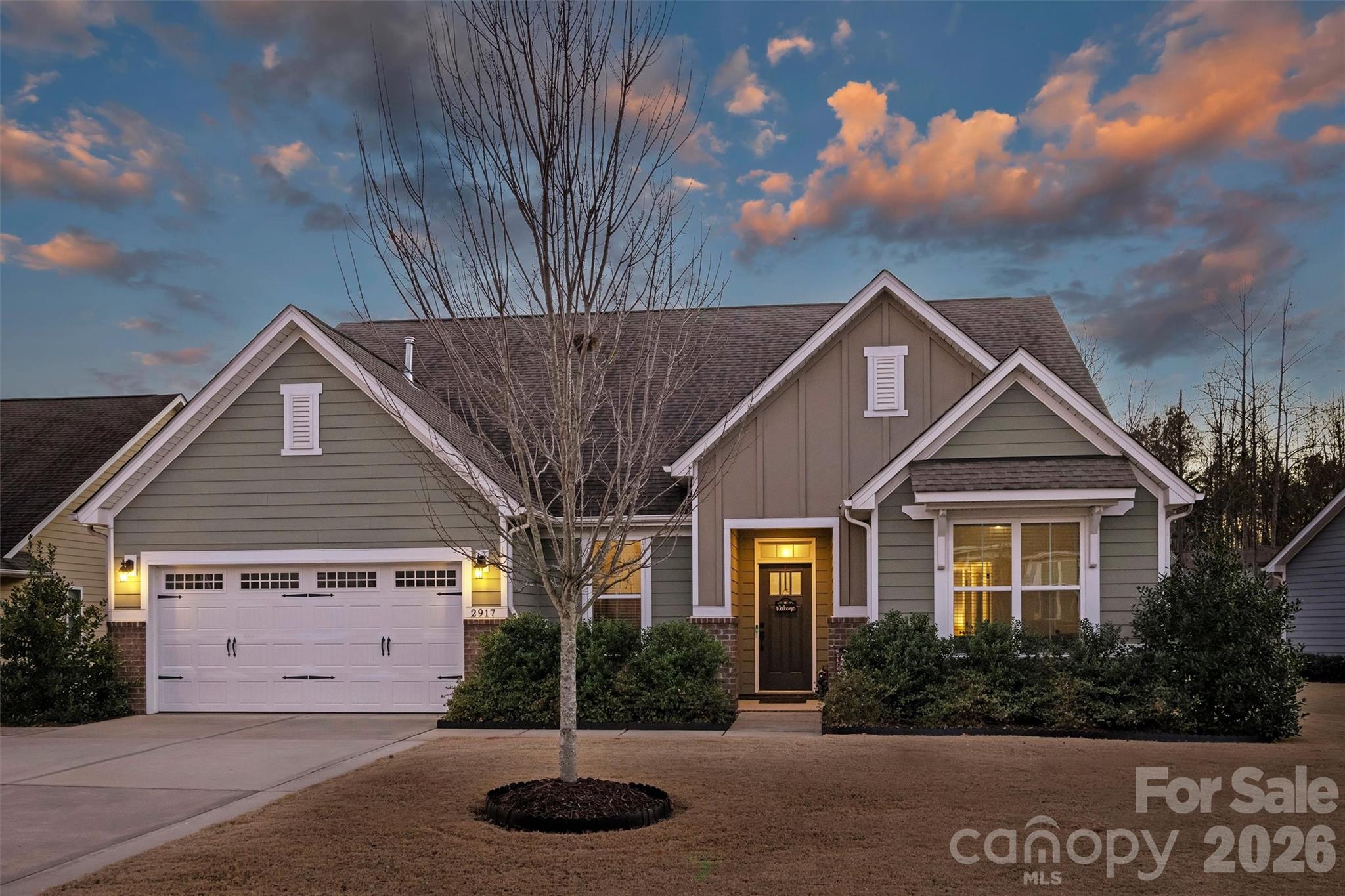 Beautiful newer 1.5-story home with an excellent floor plan and exceptional outdoor living providing over 3,000 square feet of year round living space! The expansive main level features a gourmet kitchen with a large island overlooking the scenic backyard, perfect for everyday living and entertaining. A flex room with French doors offers ideal space for a home office, dining room or sitting room. The primary suite on the main level includes a tray ceiling, oversized walk-in shower, dual vanities, and a spacious walk-in closet.

Two additional bedrooms are connected by a Jack-and-Jill bath, along with a convenient drop zone with built-in shelving on the main level. The upper-level flex room with full bath and walk-in closet provides wonderful versatility and works well as an in-law suite, teen retreat, workout room or private office.

Outdoor living truly sets this home apart with a four-season porch featuring Eze-Breeze windows, rope lighting, and a built-in TV box, plus a saltwater, remote-controlled heated pool and hot tub with a movable safety fence. Additional exterior features include a gas fire pit, sundeck, decorative fieldstone walkways, retaining wall, privacy fence, and a dwarf Japanese maple that provides excellent summer shade!  Or relax on your covered front porch and watch the world go by!  

Additional highlights include an epoxy-coated garage floor, irrigation system, keypad garage entry, dual-zone HVAC, Google Fiber in the community, and thoughtful upgrades throughout. This home offers a fabulous floor plan with open concept living and outstanding outdoor amenities in a desirable Fort Mill location, less than 2 miles to Ballantyne!  The flex room/bedroom 4 on the main level has no closet.