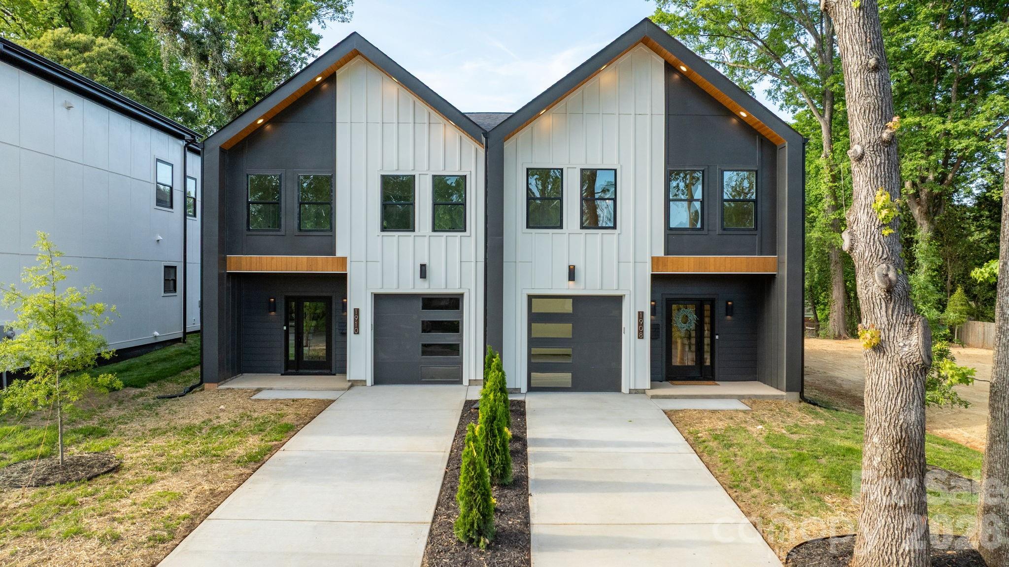 Welcome to a townhome that redefines modern living in Charlotte. Built by Halo Construction in partnership with Nava Builders, this 3-bedroom, 2.5-bath home with a 1-car garage delivers a true wow factor the moment you walk in and finishes you simply don't see in townhomes at this price point.

The kitchen is the showstopper. High-contrast, cabinetry pairs sleek black lowers with crisp light brown oak uppers, topped with 5-tier Panda quartz countertops chosen specifically to add dimension and depth. A custom designer tile backsplash runs to ceiling, framing a gas range and a full suite of black stainless steel appliances, including an LG InstaView refrigerator that lights up with a simple knock on the glass. Every surface in this kitchen was selected with intention, and it shows.

The living area is anchored by a modern electric fireplace, finished with designer lighting throughout and a custom fabricated metal railing that brings an architectural edge to the staircase the kind of detail that elevates the entire home. Even the garage steps it up with hexagonal accent lighting, signaling right away that no space was an afterthought.

Upstairs, the same intentional design carries into the bathrooms: high-end tile that flows seamlessly from the floor straight up into the shower walls, custom closet build-outs, and modern fixtures that tie everything together. On the main level, the half bath features a custom sink another small touch that sets this home apart from the typical new build.

Behind the scenes, the home is built to perform: gas furnace, gas range, and an electric water heater efficient, modern, and ready for the long haul.

Location is everything, and this one delivers. You're 5 minutes from Camp North End, less than 10 minutes to Uptown and South End, close enough to enjoy the best of Charlotte, far enough out to skip the rush hour grind. You're also surrounded by luxury residential properties, including an estate-level home right next door, so the long-term value of this street speaks for itself.

For buyers thinking about multi-generational living or an in-law setup, the full duplex is available a rare opportunity to keep family close without sacrificing privacy.
This townhome doesn't ask you to compromise. Schedule your private showing today.