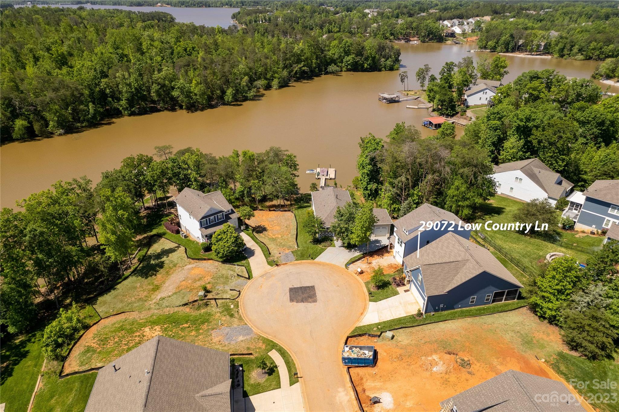 Welcome home to the beautiful resort style community of Edgewater!  This exterior of this gorgeous home was just freshly painted and will welcome you to this lake community.  From the moment you walk in you'll be welcomed with a lovely entryway leading to a secondary bedroom and full bathroom.  The main living area is bright and open, and the cook of the home will enjoy the large granite island and plenty of counter space.  Tons of seating at either the island or separate dining area.  From the great room you can exit to the screened porch and enjoy a relaxing evening.  The primary bedroom is on the main level with a large en suite bathroom.  Upstairs is another bedroom and full bathroom located over the garage.  Enjoy views of the lake on this great cul de sac lot; short distance to the community center and pool.  Down the street is the Lakeside pavilion where residents can launch paddleboards or relax on the upper deck. For the golfer, check out the Edgewater golf course!