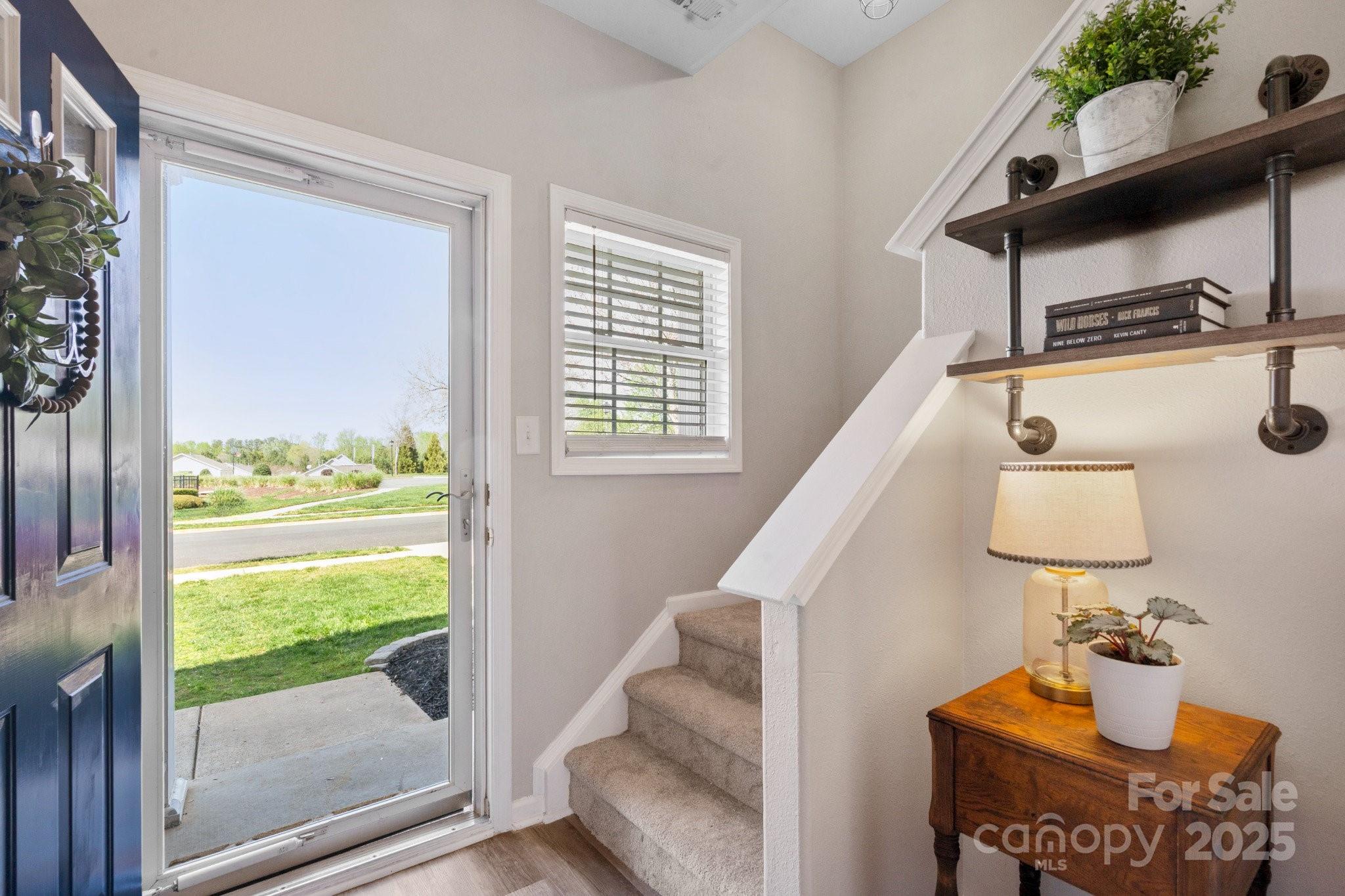 Bright, meticulous, like-new townhome in the highly sought-after Arlington neighborhood is a showstopper! The open concept floor plan allows for comfortable daily living, as well as, ease in entertaining. 3 spacious bedrooms, 2.5 baths, with a peaceful outdoor patio. One car garage and driveway allow for parking multiple cars. Additional spacious storage closet provides ample room for holiday decor, gardening tools, and so much more. 2023: new HVAC, new water heater. 2024: new LVP flooring throughout entire main floor and upstairs bathrooms. 2025: fresh paint, new upgraded carpet on stairs and throughout upper level. Close to major shopping, restaurants, amazing schools, and neighborhood amenities.