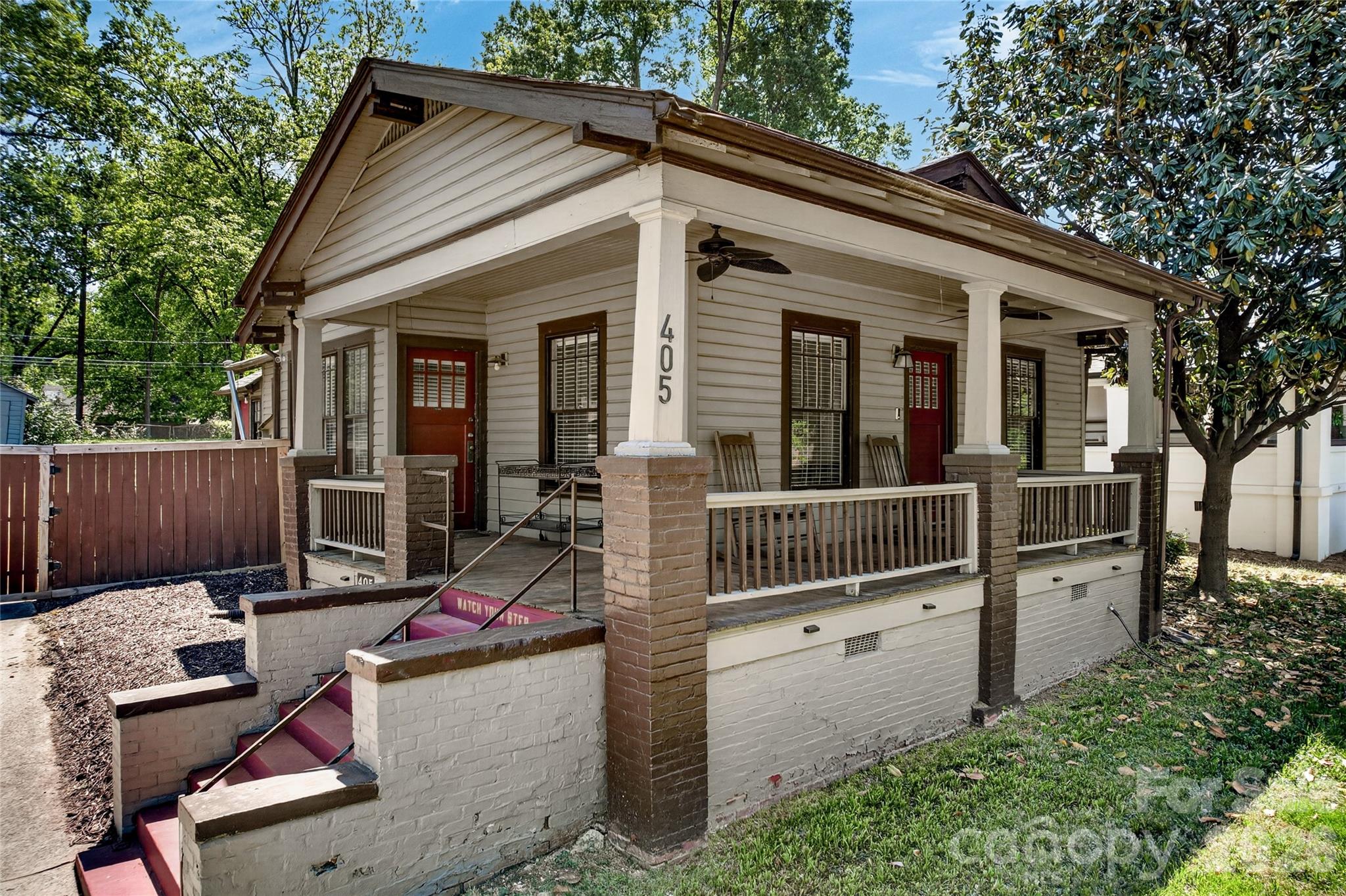 This 3-bed home in the Historic District of Wesley Heights blends historic charm, modern touches, and quick access to Uptown Charlotte. Offering 3 bedrooms, 2 full bathrooms, 1,399 square feet, no HOA, a wrap around front porch, and a rare combined 0.254-acre corner lot that includes the rear lot, this property also features a partial city skyline view from the backyard. Inside, the open layout in the main living area creates an easy flow for both everyday living and entertaining, while hardwood floors run throughout the main living area and secondary bedrooms, adding warmth and timeless appeal. The kitchen features butcher block countertops, stainless steel appliances, and modern finishes that complement the home’s classic appeal. Outside, the wrap around front porch adds welcoming curb appeal, and the corner lot setting offers added presence and outdoor space. Just minutes from Uptown Charlotte, I-77, and I-85, this home offers an ideal blend of character, convenience, and location in one of Charlotte’s most desirable historic neighborhoods.