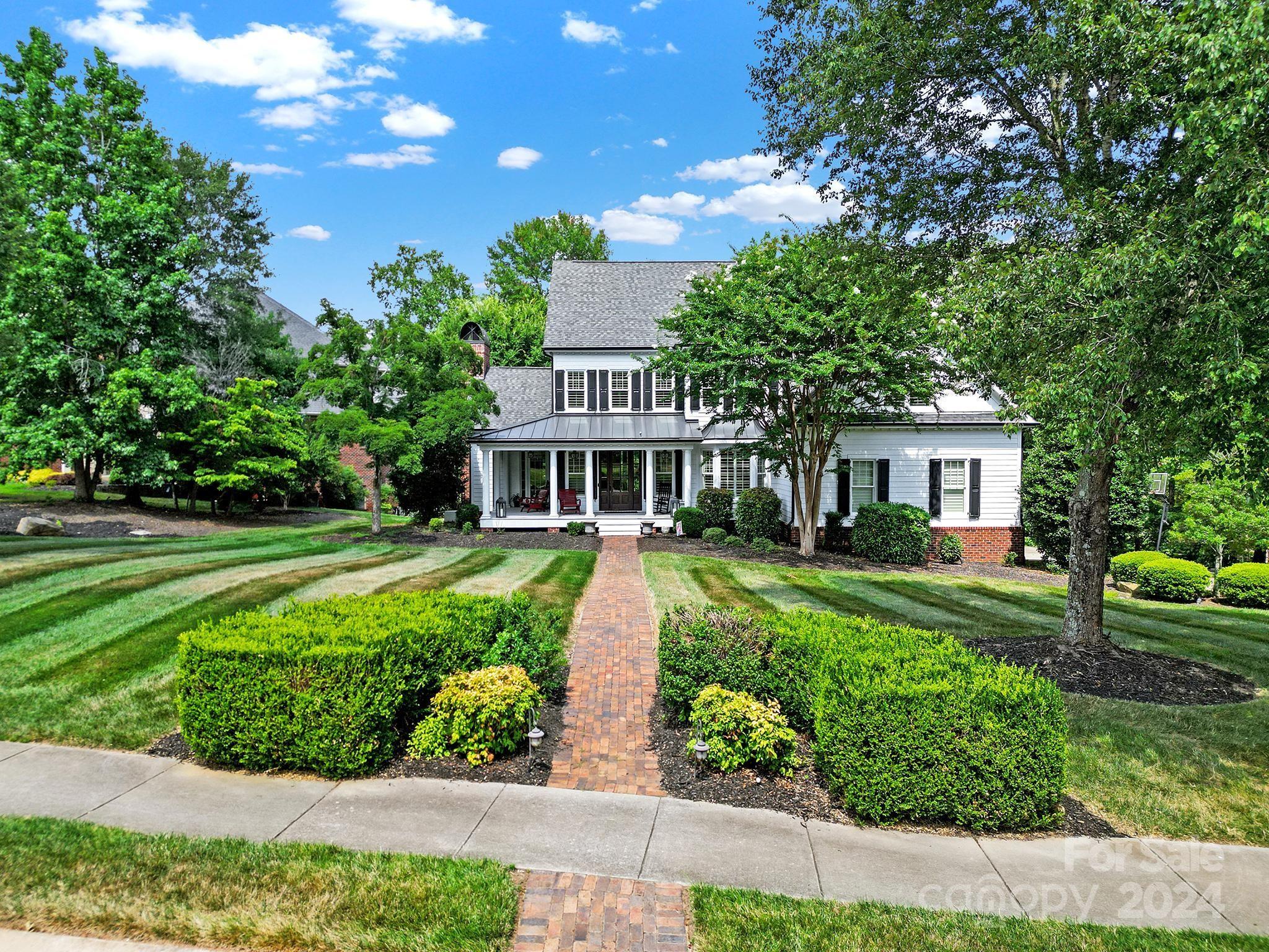 Beautiful Custom Southern Beauty with Wrap Around Front Porch & back porch in sought after Springfield Community.  Peaceful Cul De Sac outlined by holes #6 and #7 of Golf course. 4 Bedroom 3.5 Bath home sits on a .75 acre lot backing to woods. Private wooded side yard. Gorgeous Front &Back Porches perfect for Entertaining. Open Floor Plan with Primary on Main,Primary Bath featuring heated flooring, Dining Room/Office/Den, Powder Room,Gourmet Kitchen, Large Living Room with Built Ins and Gas Fireplace and Laundry Room with Sink on Main. Beautiful Hardwood Flooring, New carpet in Primary. Upstairs Features a Loft, 3 Additional Bedrooms, 2 Full Baths and a Large Multi-use Bonus Room with Closet and Walk in Attic Space that can easily be finished for additional space.  Encapsulated, large walk in Crawl space. Don't miss out. Loads of amenities including Pool, Clubhouse, Playground, Tennis Courts, Pickleball Court & Walking Trails.  Golf course is a public course. See course for membership.