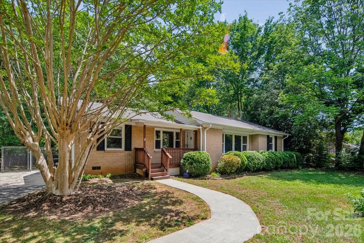 Full brick ranch in desirable Fort Mill location offers comfortable one-level living on a spacious 0.34-acre lot. Featuring 3 bedrooms and 2.5 baths, the home includes over 2,100 square feet with a functional layout designed for everyday ease. The living room flows into a dining area with a fireplace and well-equipped kitchen with ample cabinetry. Flooring includes a mix of carpet and laminate wood for durability and comfort. Enjoy outdoor living with a rear deck and patio overlooking a fully fenced backyard, perfect for relaxing or entertaining. Additional highlights include a dedicated laundry room and shed for extra storage. Conveniently located near schools, shopping, and major routes, this property presents a solid opportunity ready for your personal touch in an established neighborhood with no HOA.
