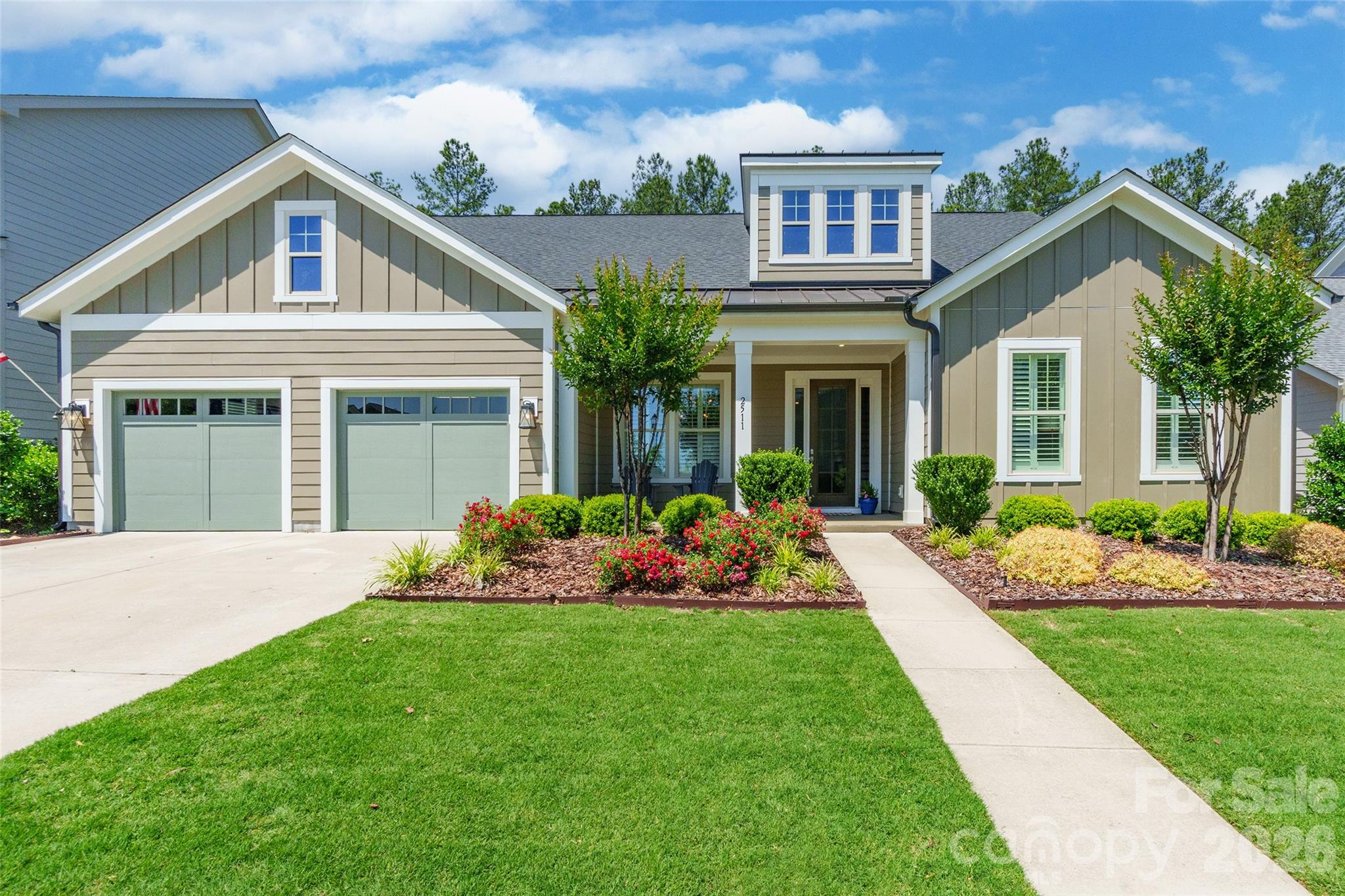 Welcome to this beautifully designed 4-bedroom home in the highly desirable Paddlers Cove community, offering the perfect blend of comfort, style, and outdoor living. Featuring a spacious open floor plan with an upstairs loft, this home was made for easy everyday living and effortless entertaining.

The gourmet kitchen is a true centerpiece, complete with a gas cooktop, walk-in pantry, and plenty of space to gather. The main-level primary suite provides a private retreat, while the additional bedrooms and loft offer flexibility for guests, work, or play. Elegant plantation shutters throughout the home adds timeless charm and sophistication.

Inside, you'll find a beautiful gas fireplace anchoring the main living area, creating a warm and inviting atmosphere. Step outside to an incredible extended patio designed for year-round enjoyment, featuring a second gas fireplace, outdoor kitchen, and firepit, the ultimate outdoor living space for relaxing or entertaining.

Located in sought-after Paddlers Cove, residents enjoy resort-style amenities including two community pools, a clubhouse and is walking distance to Field Day Park, which offers pickleball courts, athletic fields, playgrounds, and scenic walking trails. This home truly offers the lifestyle buyers are looking for.