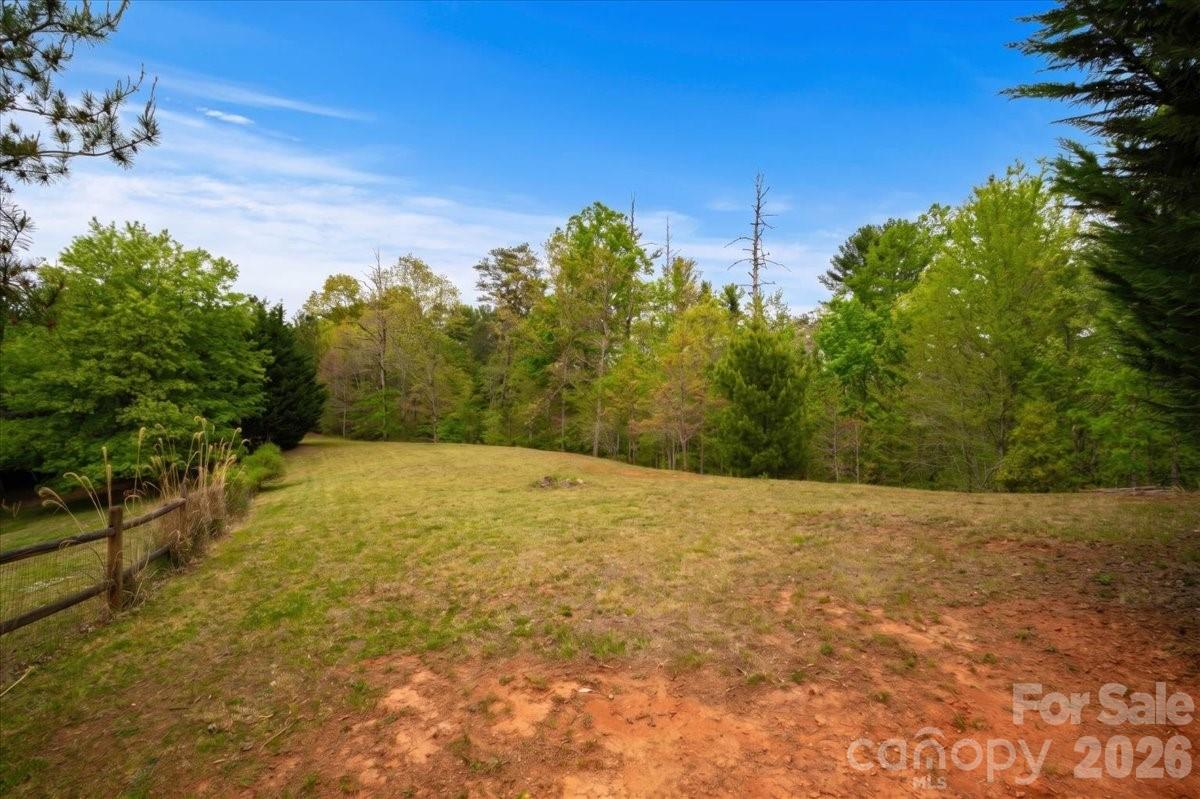Welcome to Lot 6 of Reaston Ridge, where convenience meets mountain serenity. This property is ideally located with easy access to I-26; being just 20 minutes from Asheville, 10 minutes from Weaverville and Mars Hill, and 30 minutes to AVL Airport and Burnsville. This mostly level homesite offers the perfect foundation for your next chapter. Whether you're envisioning a full-time residence or a mountain retreat, the gentle topography makes for an easy build and low-maintenance yard. 

Nature lovers will appreciate the wooded portion that enhances the property’s peaceful setting, while still offering stunning year-round mountain views. With low HOA fees and thoughtful, reasonable restrictions, Reaston Ridge strikes the perfect balance between freedom and community. 

Enjoy the best of WNC right outside your door, with nearby opportunities for hiking, mountain biking, ziplining, and disc golf. Off-frame modular homes are permitted with approval, giving you added flexibility to bring your vision to life. If you're looking for a quiet neighborhood with easy access to town and endless outdoor adventure, Lot 6 is ready to welcome you home.

Buncombe County approved the property for a 4-bedroom septic system in June 2026!

Visit https://kairosartistryphotography.hd.pics/media/download2.asp?5D39122D69FE4095B36FCE56C1887557 to view the concept home digital rendering!