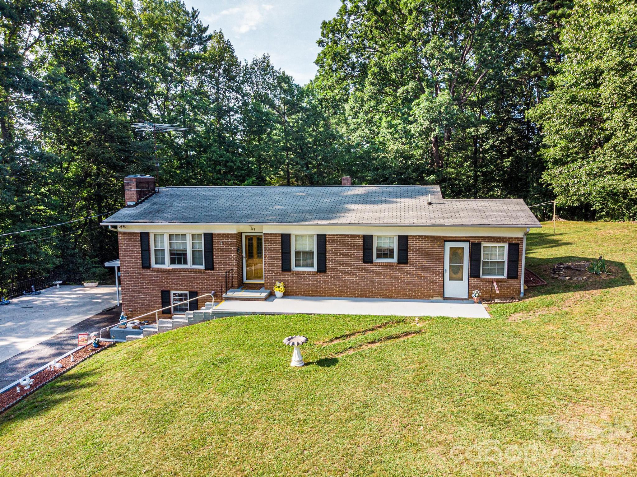 Well-maintained brick home situated on a .46-acre lot, with an additional adjoining .47-acre lot included, offering nearly an acre of property. Connected to city water and city sewer, this inviting home features a cozy living room with a fireplace, creating the perfect place to relax.

The kitchen offers ample counter space, a charming breakfast nook, and all appliances are included, including a range that is only one year old. Just off the kitchen, the dining area is filled with natural light, making it an inviting space for everyday meals or entertaining.

The main level includes 2 bedrooms and 2 full bathrooms. The partially finished basement features a spacious den that could easily serve as a third bedroom, home office, or recreation room, and includes a wood-burning stove. The remaining unfinished portion of the basement provides excellent storage with built-in shelving.

Enjoy the covered rear deck, perfect for relaxing or entertaining outdoors. The home also offers an attached single carport, a large concrete parking area, and the added bonus of the adjoining lot, providing extra space and possibilities.

This is a sweet, well-cared-for home that's ready for its next owner!