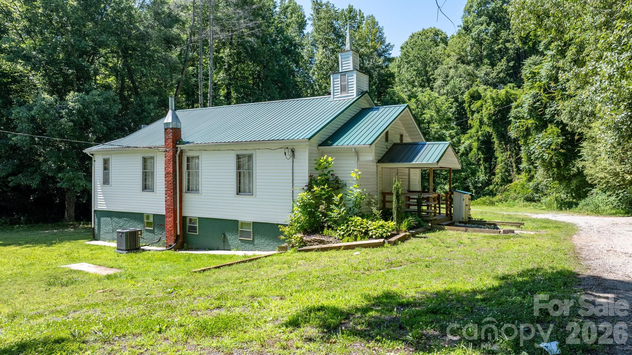 Unique opportunity to own a historic 1936 church property with the potential to become a one-of-a-kind residence, retreat, gathering space, or continue its legacy as a place of worship. Located in a Rural Residential (R-R) zoning district, this property offers flexibility for a variety of future uses, including residential conversion, subject to applicable permits and approvals. The building's charming country-church architecture, complete with a covered front porch, white vinyl siding, and metal roof, creates a nostalgic setting reminiscent of a simpler time. Inside, the main level features a welcoming foyer, two half bathrooms, a spacious sanctuary with traditional pew seating, a raised platform area, sound system controls, projector and screen, and additional rooms that could easily be reimagined as bedrooms, offices, living areas, or storage space. A piano will convey with the property. The full basement offers both interior and exterior access and includes multiple partitioned rooms that were previously utilized for Sunday school classes and study groups. With painted concrete floors and block walls, the lower level provides substantial space for storage, workshops, recreation areas, or future expansion plans. Outside, the property offers gravel parking areas on both sides of the building, an older picnic shelter situated on a concrete pad, and a peaceful stream bordering the southern property line. Historical information suggests additional homes once existed on the property, which may be of interest to buyers exploring future development possibilities. For buyers seeking a unique residential project, the existing layout and structure provide an excellent canvas for conversion into a distinctive home with character and history. For religious organizations or community groups, the property may continue to serve as a place of worship through the applicable special use permitting process with the local jurisdiction. Whether your vision is a custom residence, private retreat, community gathering space, or the continuation of its longstanding role as a church, this property presents a rare opportunity to own a piece of local history while creating something truly special for the future.