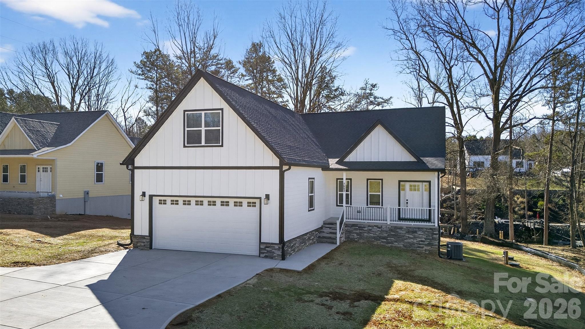 Stunning new construction waterfront home on Lake Norman featuring a private floating pier. Located in desirable Sherrills Ford, just minutes from shopping and dining, this 3-bedroom, 2.5-bath home offers an open-concept kitchen and living area designed for modern lake living. The upper-level bonus room provides flexible living or entertainment space. The walkout finished basement features sliding glass doors, a spacious living room area, bar, and flex room ideal for a home office, gym, or guest space. Enjoy peaceful lake views from the screened porch and expansive deck overlooking the water. The backyard offers room to add a swimming pool. No restrictions, making this property ideal for investors or buyers seeking a vacation rental opportunity. A 2-car garage completes this exceptional waterfront home.