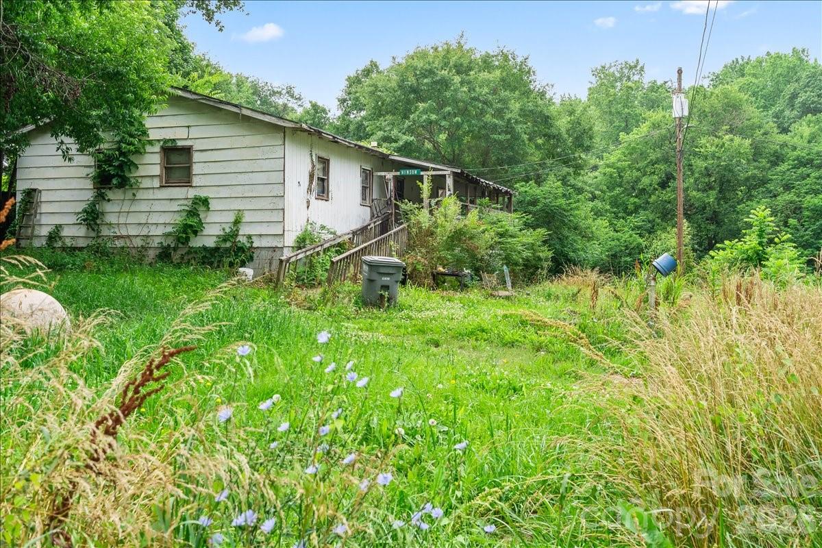 Tucked away in an established Belmont neighborhood, this property offers a unique opportunity just minutes from the charm and convenience of downtown Belmont. Enjoy close proximity to local dining, shopping, parks, schools, and recreational facilities while remaining within a desirable in-town location. Situated on a generous lot offering added privacy, the property provides ample outdoor space and potential for a variety of future possibilities. Convenient access to major highways and employment centers adds to the property's appeal. A compelling opportunity for investors, renovators, or buyers looking to add value in a highly desirable Belmont location. Property sold as-is.