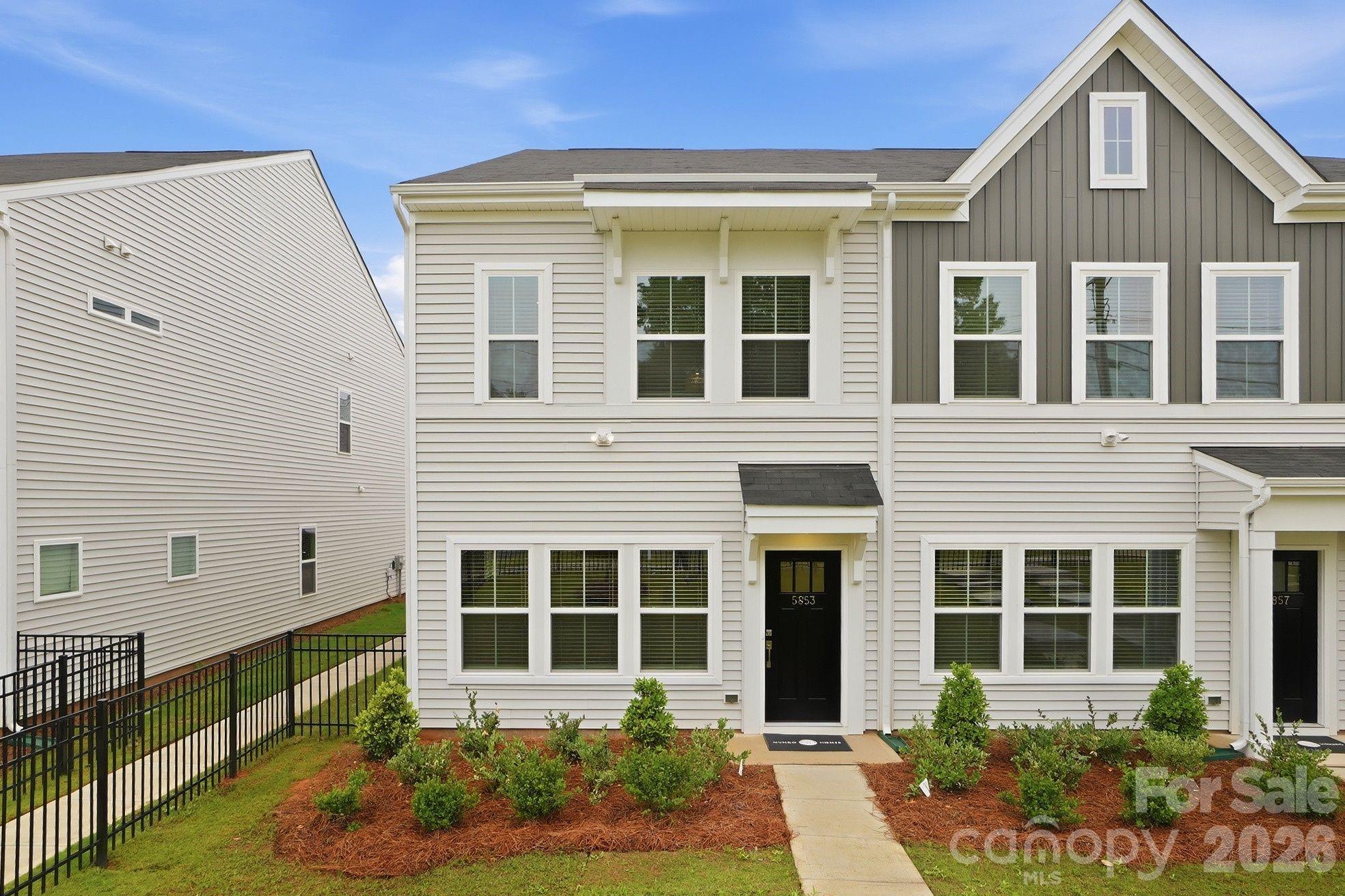 Modern new construction townhome living meets everyday Charlotte convenience at Sloan Station. Built by Mungo Homes, this end-unit Clover floorplan offers 3 bedrooms, 2.5 bathrooms, an open-concept main level, and a spacious one-car garage, giving buyers the feel of single-family living with the ease of low-maintenance townhome ownership.

The main level features 9-foot ceilings, recessed lighting, luxury vinyl plank flooring, a pantry, mud room, and thoughtful storage throughout. The great room flows seamlessly into the kitchen and eat-in dining area, creating an easy layout for everyday living or entertaining. The kitchen includes a spacious island, quartz countertops, tile backsplash, pendant lighting, ample cabinet space, and designer finishes.

Upstairs, the primary suite offers tray ceilings, a walk-in closet, double vanity sinks, quartz bathroom countertops, and a tiled shower. Two additional bedrooms, a full bathroom, and an upstairs laundry closet complete the second floor.

Sloan Station offers quick access to Uptown Charlotte, I-85, Charlotte Douglas International Airport, South End, Wesley Heights, FreeMoreWest, the West Morehead corridor, the U.S. National Whitewater Center, and the Charlotte Regional Farmers Market. Additional features include HOA-maintained exterior upkeep, a community dog park, a 2-10 structural warranty, and 30-day and 11-month builder checkups.