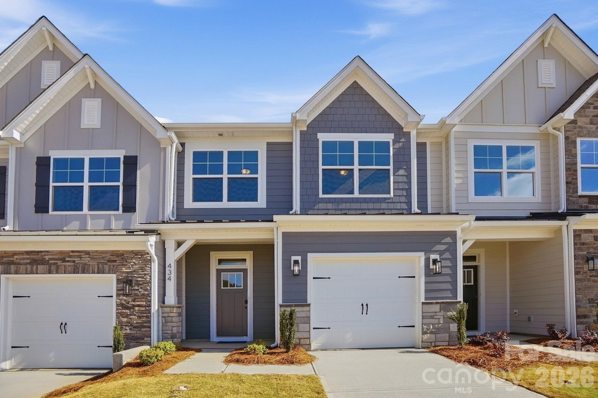 New townhomes ready for you in the heart of Waxhaw! This Ashland plan has 3 bedrooms, 2.5 baths, and more than 1,800 square feet. Enter the home through the foyer with tray ceiling, Craftsman-style trim, and a convenient drop zone to see the light and bright kitchen, dining area and family room. The kitchen features white, Shaker-style cabinets and white quartz counters, a spacious island, white tile backsplash, and stainless appliances, including a gas range. The open main floor has wonderful Enhanced Vinyl Plank flooring throughout. Stairs with composite treads and metal balusters lead upstairs to the loft, bedrooms, baths and laundry room. The primary bath has a tiled shower with bench seat, dual-sink vanity, and linen closet. Walking distance to shops, eateries, and other conveniences. Visit today!