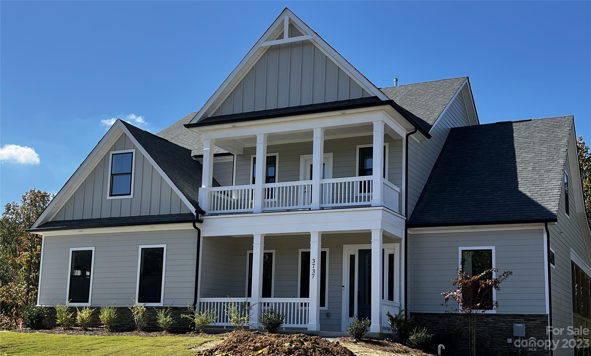 Home is complete except for delay in county water/sewer connection, which has caused delays in some interior  finishes. Completed photos coming soon! Beautiful 5 BR/4.5 BA home with Primary Suite and guest bed/bath on main, & finished basement in highly sought after Handsmill. Epicurean Kitchen with granite countertops, double wall oven, and farmhouse island that is perfect for gathering Family & Friends, opens to Casual Dining area and Family Room that features modern fireplace with gorgeous surround & lots of natural lighting, opening to semi wrap around covered back deck. Impressive Owner's suite features tray ceiling & huge walk-in closet. Gorgeous owner's bath has quartz countertops & large walk-in shower! Upstairs opens to huge loft, perfect for entertainment and leisure! Basement features large rec area, full bath, wet bar, and plenty of storage space! Interior photos representative & some details may differ. Options, colors, etc in MLS may change before/during construction
