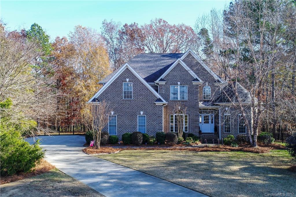 ALL BRICK home with a master bedroom and a guest bedroom on the main level! Located in the private and peaceful community of Vander Lakes. Hardwood floors on the main level with a open floor plan to suit all entertaining needs. Functional kitchen with Corian countertops and plenty of cabinets. Newer carpets in all bedrooms and a large bonus room that can be used as a 5th bedroom. This home sits on a heavily wooded 1 acre fenced cul-de-sac lot with a large deck. Fantastic schools & Low HOA fees!