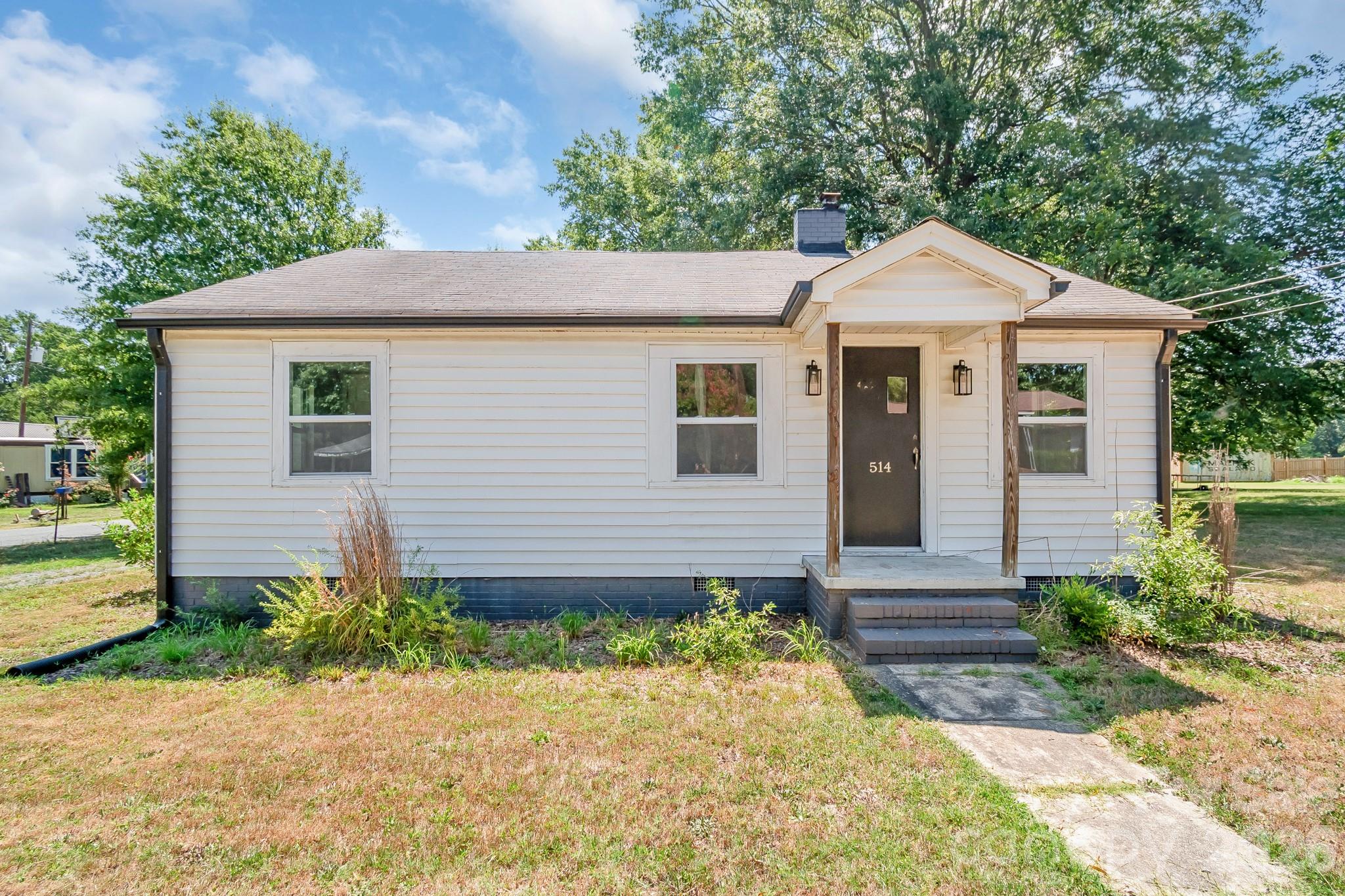 Welcome home to this charming, updated one-level home offering 2 bedrooms, 1 bath, with comfortable living space. Situated on a 0.26 acre lot and just minutes from the growing downtown Marshville, this home is perfect for first-time buyers, downsizers, or anyone looking for an affordable place to call home! Many updates were completed in 2021/2022, including an HVAC system installed in 2022, flooring throughout, paint, kitchen updates (cabinets, countertops, appliances), lighting and bath updates as well. Outside, mature shade trees create a relaxing setting, while the spacious back and side yard offer endless possibilities for entertaining, gardening, or enjoying cool Carolina fall evenings. Two storage sheds provide excellent space for tools, hobbies, or outdoor equipment. The next buyer can create a useful mudroom area as you walk in the back door- keep life organized! The seller is offering an $1,100 credit toward new carpet/ flooring. The Washer, Dryer and Refrigerator convey with the home also! Don't miss this move-in-ready home with room to make it your own!