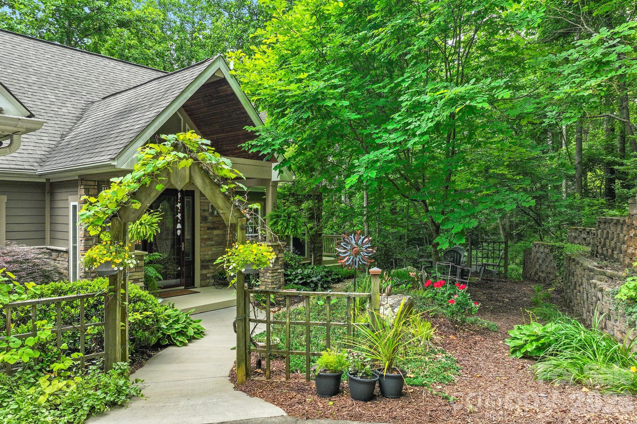 TOP TEN REASONS TO LOVE THIS PROPERTY! 1. MOUNTAIN VIEW! As you walk into the house, your eye will immediately be drawn to the magnificent mountain view. Watch the seasons change from the spacious decks. 2. PRIVATE 1.9 ACRE SETTING in a quiet, established neighborhood with low turn-over. 3. CUSTOM DESIGNED hybrid home with site built lower level and custom modular main level specifically designed and engineered for this site. 4. LOCATION - just minutes to both Weaverville and Asheville—enjoy privacy and easy roads without sacrificing convenience. 5. ONE-LEVEL LIVING with a comfortable layout, natural light, and well-maintained, timeless finishes. 6. EXPANSION POTENTIAL with two unfinished walk-up rooms upstairs— ideal for additional living space, rec room, workout space, a home office, or studio. 7. SERIOUS WORKSHOP space in the unfinished basement—perfect for woodworking, artist studio, or hobbies, with most equipment available to convey. 8. ARTESIAN WELL provides a reliable, desirable natural water source. 9. GENERATOR (PARTIAL) keeps the well running during power outages—an invaluable feature for mountain living. 10. CONNECTIVITY with Spectrum internet/cable available, plus, Frontier fiber in the works. BONUS: Outstanding value compared to nearby homes—offering space, flexibility, and features that are hard to find at this price point. Lower level bedrooms share an expanded jack & jill bath for convenience and privacy for each room. A perfect blend of serene mountain views and wooded privacy, this peaceful Blue Ridge mountain retreat is a perfect primary residence or vacation home and is an easy 10-minute drive to downtown Weaverville restaurants and amenities. UNCA and downtown Asheville are about 20 minutes away. Access to the Blue Ridge Parkway is off nearby Ox Creek Rd. NEAR Hiking, fishing, kayaking, canoeing, road biking, mountain biking, breweries, art galleries, world class restaurants, UNCA's OLLIE program, and so much more. Over-sized garage. This is a rare opportunity for a move-in ready mountain VIEW home that doesn't have a mountain road to get to it and is close to all you will want to enjoy! Neighborhood does not allow STRs. Ask your agent for all disclosures and provided information.