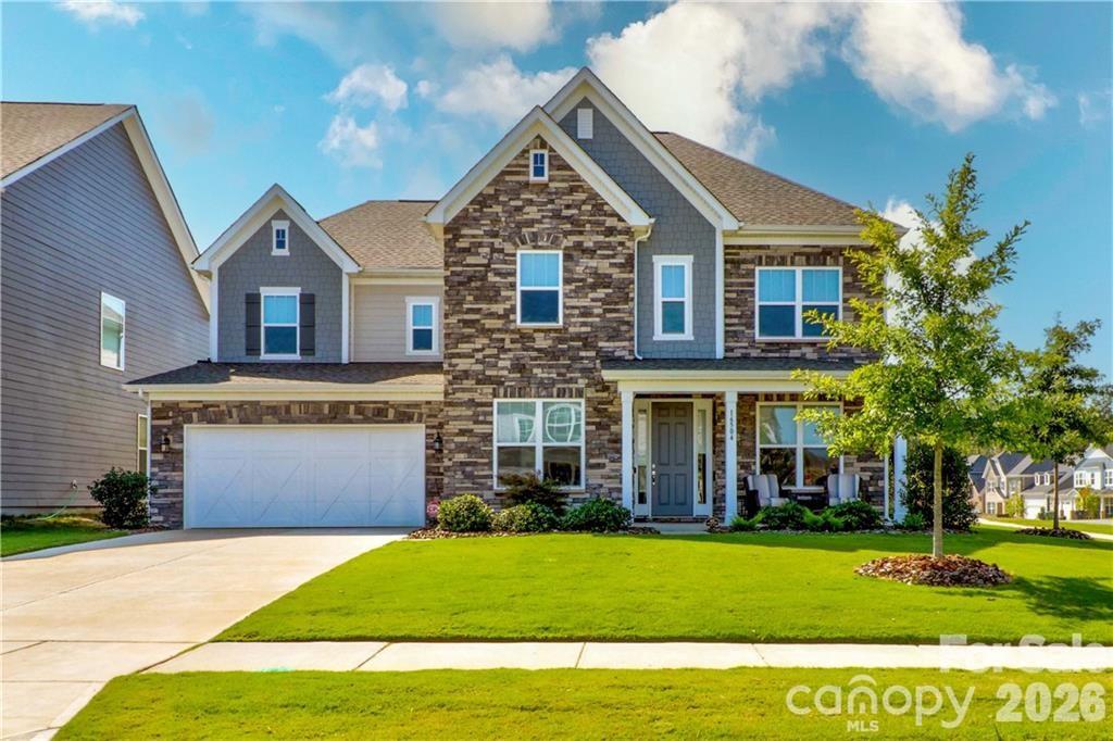 Step inside to experience soaring doorways, high ceilings, open floor plan, loads of natural light, tray ceilings and a fenced backyard beautifully positioned on a corner lot.  Featuring 4-bedrooms, 4.5 baths, 2 car garage, and a spacious bonus room—a perfect space for an extra bedroom, a media room, a playroom, or a home gym. 
Just off the foyer is a large private home office with French doors, a spacious dining room with tray ceilings and a butler's pantry. The main level also includes a secluded guest suite with full bath that has a walk-in shower. The gourmet kitchen includes a large island, stainless steel appliances, gas cooktop, quartz countertops, tile backsplash, and an expansive custom pantry. Upstairs, the expansive primary suite features tray ceilings, a spa-like soaking tub with dual vanities, separate tub and walk-in shower and a huge custom walk-in closet with direct access to the laundry room. The secondary bedrooms offer comfortable layouts that are bright and roomy with ample closet space.  
The backyard offers maturing privacy trees, professional landscaping and an enclosed patio—perfect for relaxing or entertaining.
Located in the North Reach area of The Palisades Community, enjoy all the resort like amenities The Palisades Country Club offers- swimming, tennis, golf, fitness center, pickleball and more—all just minutes from Lake Wylie.