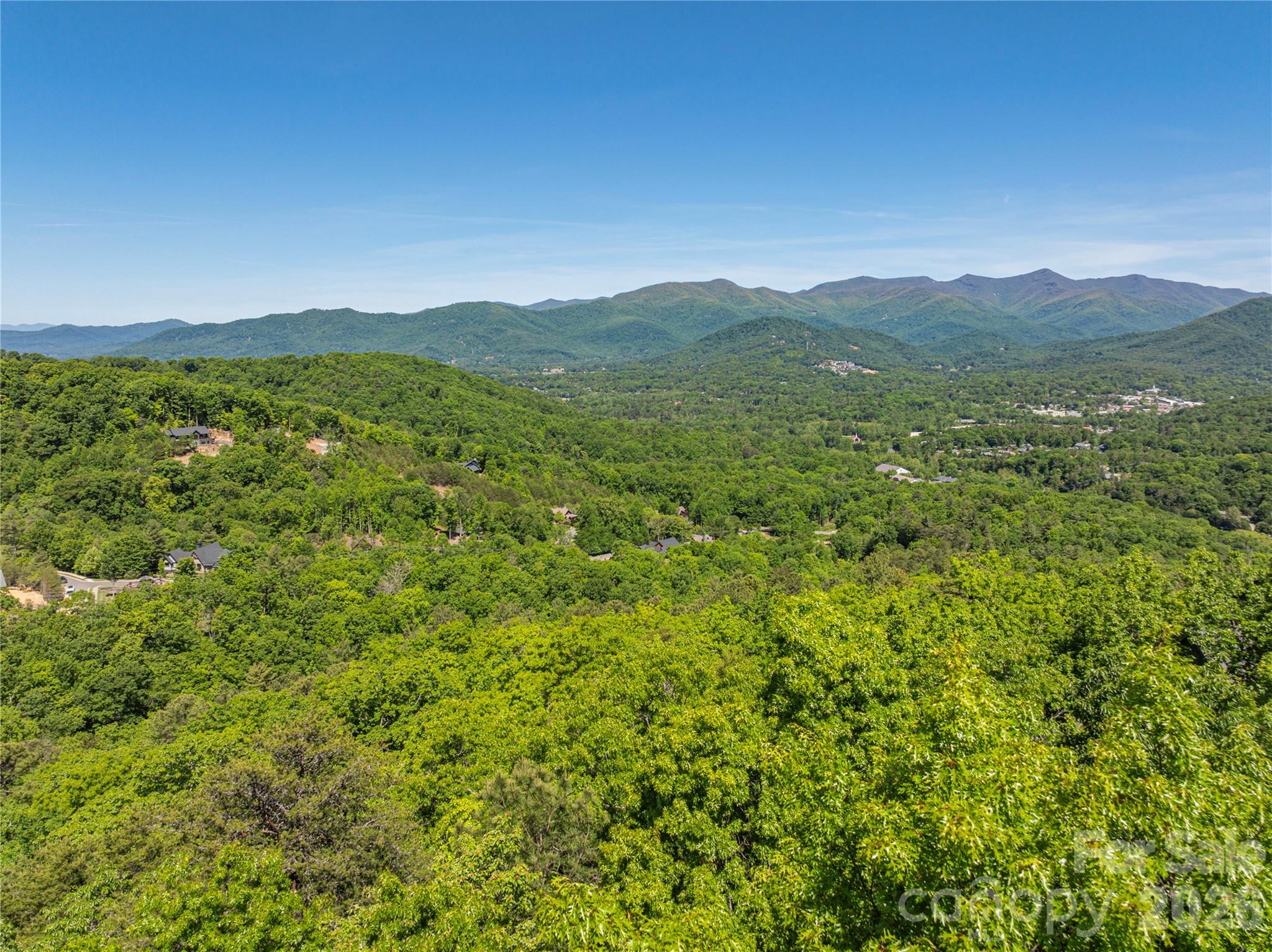 Build your mountain dream home in The Settings of Black Mountain, one of Western North Carolina’s premier gated communities. This exceptional home site offers panoramic views of the breathtaking Black Mountain Range, including the iconic Seven Sisters peaks, while overlooking the charming town of Black Mountain. Surrounded by the stunning beauty of the Blue Ridge Mountains, this property perfectly combines luxury mountain living with privacy, convenience, and natural serenity.

Residents enjoy an outstanding collection of community amenities including a spectacular clubhouse, scenic hiking and walking trails, sidewalks, playgrounds, underground utilities, and high-speed fiber optic internet. City water and sewer availability add even more convenience and value, making this an ideal setting for either a full-time residence or a relaxing mountain retreat.

Located just minutes from downtown Black Mountain and only 20 minutes from Asheville, you’ll enjoy easy access to local restaurants, breweries, shops, art galleries, and endless outdoor recreation while still experiencing the peace and tranquility of mountain living. Don’t miss this rare opportunity to own a piece of Western North Carolina paradise in one of the area’s most sought-after communities.