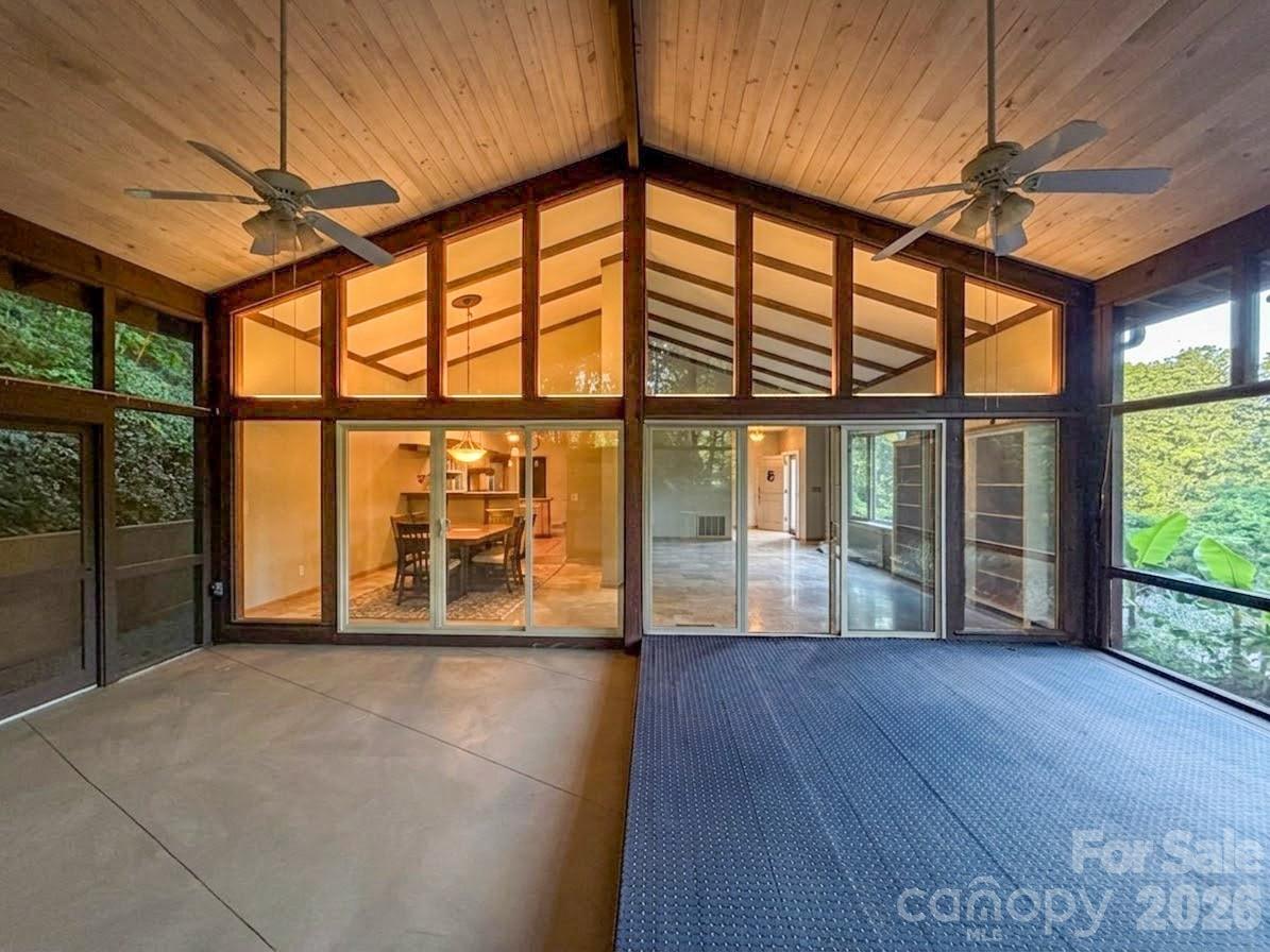 In 1971, this house was FABULOUS - and Tryon was historic. This Holland Brady designed home (look him up if you’re not familiar, it’s a big deal) was a swanky, modern Manhattan penthouse-like interior set on a perfect private ridge to take in the lush mountain views and old growth woods all around.  The design and floor plan are elegant. The original appeal remains, and the house is move in ready however new owners may choose to restore some of the mid-mod finishes. This location is a game changer for golfers with the storied, stunning, 1916 Donald Ross course right across the road to play everyday.  It’s incredibly beautiful. Entertain or relax by the wood burning fireplace in the primary living room space with your bar nook.  Enjoy the breeze and views from the dreamy, gigantic screened porch surrounded by nature.  Formal living and dining are also on main level with kitchen. The location is private - on top of a small ridge up a long, impressive stone lined driveway.  Thoughtfully designed for this site, this home is solid and the bones are strong. The glorious clash of old Tryon and modern Holland Brady is still palpable. Really a spectacular location as Country Club Road is not a through street, and for nature lovers it offers endless opportunities for walks and rides, even into town. Square footage is approximate until measured. 2 car attached garage has a temporary divider wall which can be removed.  Sellers / heirs representing the estate are not local so this is an as-is sale with limited property disclosures.