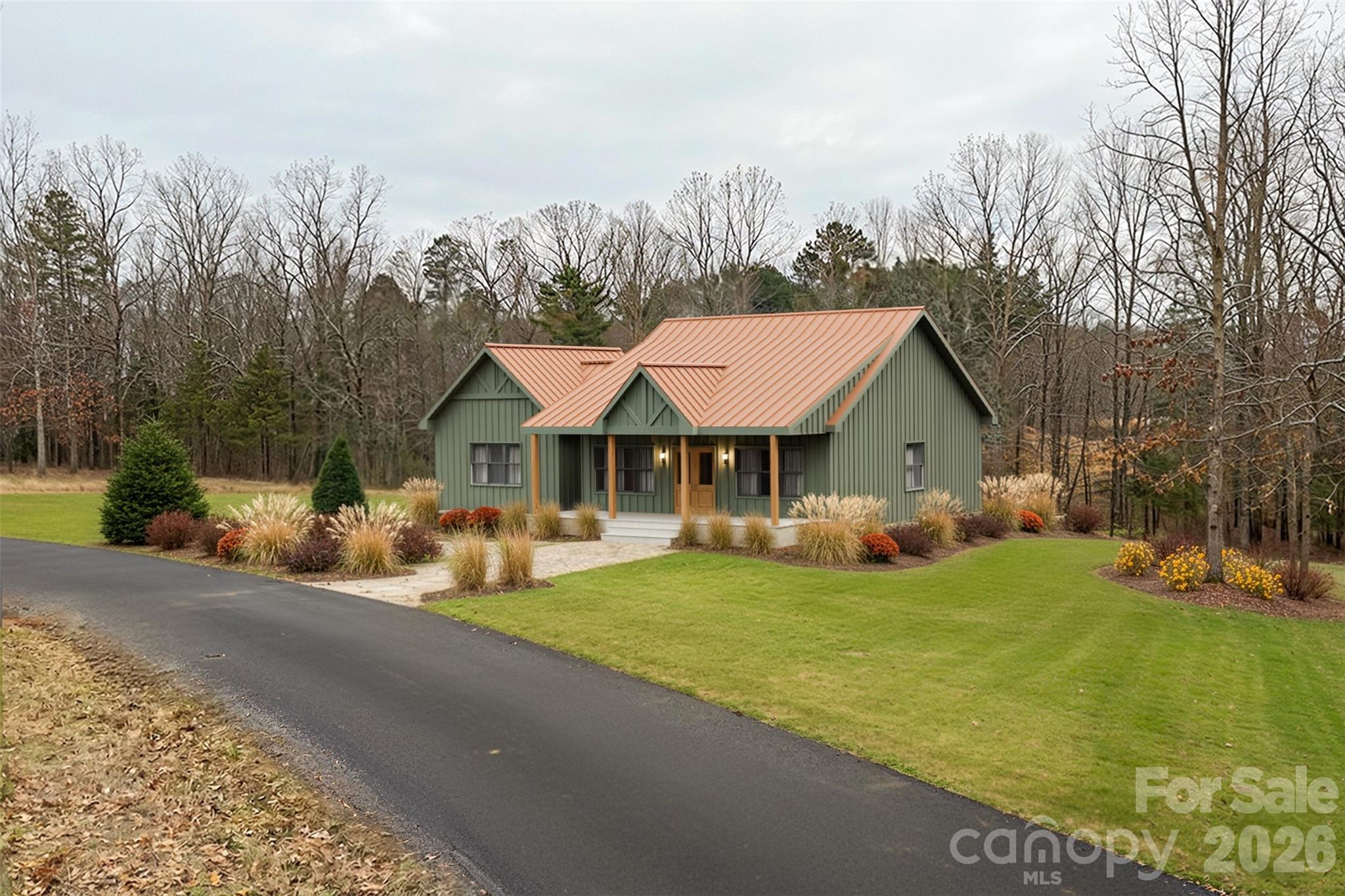 Discover the perfect blend of mountain serenity and modern luxury in the highly sought-after, gated community of Ole Plantation. This proposed new construction offers a stunning single-level, split-bedroom floor plan designed for effortless entertaining and everyday comfort.
Property Highlights:
• Striking Exterior: Earthy green board-and-batten siding, a copper-toned metal roof, a welcoming timber-framed front porch, and a custom crushed-stone fire pit area perfectly suited for the wooded surroundings.
• Open-Concept Living: The light-filled main space features soaring ceilings, gorgeous exposed wooden beams, oversized windows, and rich hardwood flooring throughout.
• Chef’s Kitchen: Overlooking the living area, the kitchen boasts crisp white shaker-style cabinetry, a massive center island with seating, high-end stainless steel appliances, and elegant stone countertops.
• Private Primary Suite: Tucked away on its own wing, the master retreat includes a sliding barn door and a spa-like en-suite bath with a freestanding soaking tub, dual vanities with gold fixtures, and an oversized walk-in shower.
• Guest Quarters: Two additional well-appointed bedrooms and a full secondary bathroom sit on the opposite side of the home for ultimate privacy.
Enjoy the exclusivity of a gated community while remaining just a short drive from the charming shops, dining, and outdoor recreation of Rutherfordton. Don’t miss your opportunity to customize this mountain-chic getaway!