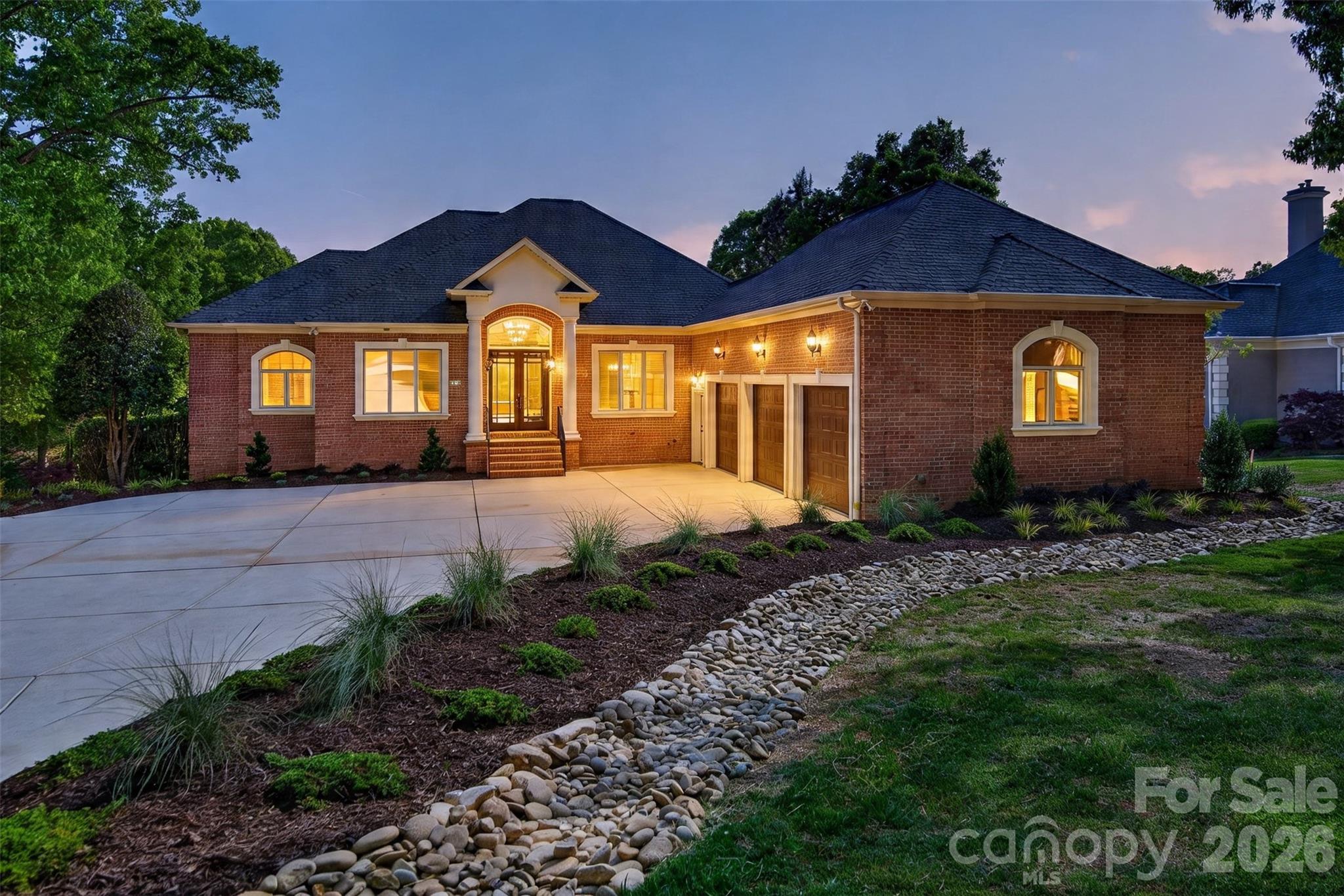REFINED WATERFRONT LIVING AT IT’S BEST! Meticulously renovated custom full brick Ranch/Basement home on the shores of Lake Norman. From the moment you enter this beautifully renovated and light-filled home, your breath will be taken away! The main focal point of this is the new two-story stone fireplace with built-in bookcases. A great spot for family gatherings or to relax and enjoy your wonderful water views. There is a first-floor office for a quiet workspace. The open and spacious Dining Room gives you ample space for holiday dinners. The light and bright Kitchen has all new appliances (excluding refrigerator), painted cabinetry, built-in bench seating w/storage and an ample breakfast/dining space for morning coffee and informal meals. Off the Kitchen is a large screened in porch to enjoy mosquito-free evenings outdoors. There is also an uncovered porch area for additional outdoor space. Lastly, there is the bright and oversized Owner’s Suite w/sitting area; a great spot to relax and enjoy a great book or simply enjoy your exquisite views. Before you enter the Owner’s Bath, you’ll pass dual walk-in closets. Your bath features separate vanities, a jetted tub and an ample sized walk-in shower. Down the hall leading to the 3-car garage, you’ll reach one of two main level half baths as well as a large and separate Laundry Room with ample storage. Off the hallway you will find the open staircase taking you to the lower level; where you have three ample-sized secondary bedrooms, a full bath with walk-in shower and a spacious Family Room with dual sided fireplace, which opens into one of the lower-level bedrooms. The entire front portion of the basement has below grade storage with expansion possibilities. The rear yard offers a gradual walk down to the covered dock. The rear yard can accommodate a pool.  The quiet cove location is just minutes to open water. CONTRACTOR TO ADD 2ND FULL BATH IN LOWER LEVEL, INCLUDED AT LIST PRICE. DON’T MISS THIS GREAT OPPORTUNITY TO START ENJOYING LAKE LIVING!!!