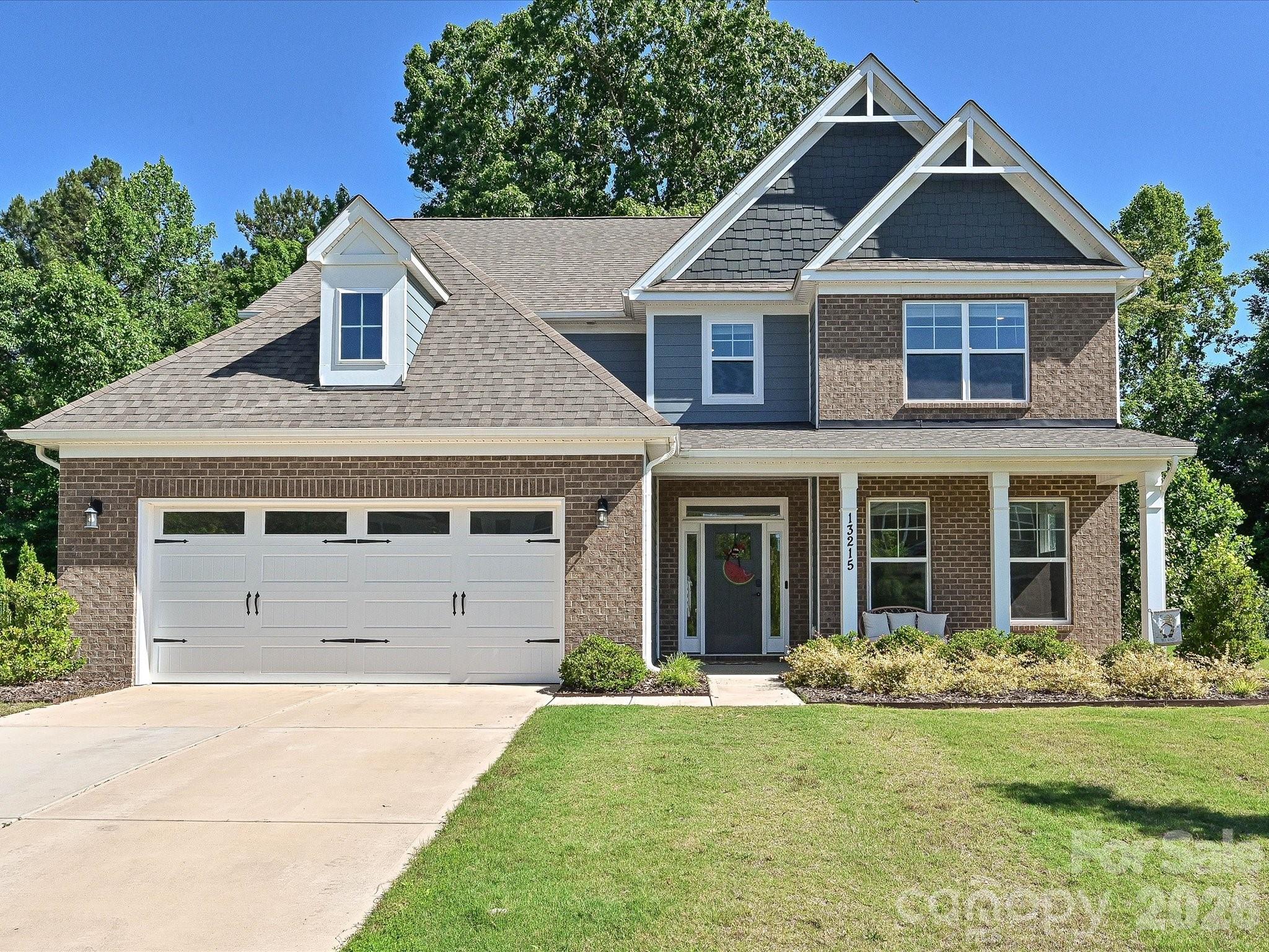 Better than new and loaded with designer upgrades, this stunning 2022-built home offers over 3,500 square feet of luxury living across three finished levels in one of Huntersville’s most desirable communities. Featuring 5 bedrooms, 4.5 bathrooms, a main-level guest suite, private office with French doors, and a dramatic floor-to-ceiling stone fireplace, this home combines upscale design with exceptional functionality.

The heart of the home is a beautifully appointed gourmet kitchen featuring white cabinetry, a contrasting gray island, quartz countertops, tile backsplash, stainless steel appliances, a gas cooktop, and a butler’s pantry complete with a beverage refrigerator. The open-concept layout flows seamlessly into the spacious living area, creating the perfect setting for everyday living and entertaining.

The main level also features a formal dining room with tray ceiling, a private office, convenient drop zone, and a guest suite with full bath. Upstairs, the spacious primary suite serves as a private retreat with a luxurious ensuite bath and generous walk-in closet. Additional bedrooms, full baths, a versatile bonus room, and conveniently located laundry provide plenty of space and flexibility. The third level offers even more possibilities with a large fifth bedroom and full bath, making it ideal for guests, a media room, home gym, or multi-generational living.

Thoughtfully selected finishes throughout include wide-plank EVP flooring, designer lighting, black hardware and fixtures, metal stair balusters, quartz surfaces, and timeless neutral tones. The home has also been enhanced with professionally installed LeafFilter gutter guards, providing low-maintenance exterior upkeep and added peace of mind.

Enjoy resort-style community amenities including a pool, cabana, and playground, all conveniently located near Birkdale Village, Lake Norman, shopping, dining, and major commuter routes including I-77 and I-485.

Meticulously maintained and move-in ready, this exceptional home offers the rare opportunity to enjoy like-new construction without the wait. $4,500 LENDER PAID CLOSING COST CREDIT AVAILABLE THROUGH PREFERRED LENDER. INQUIRE FOR MORE DETAILS.