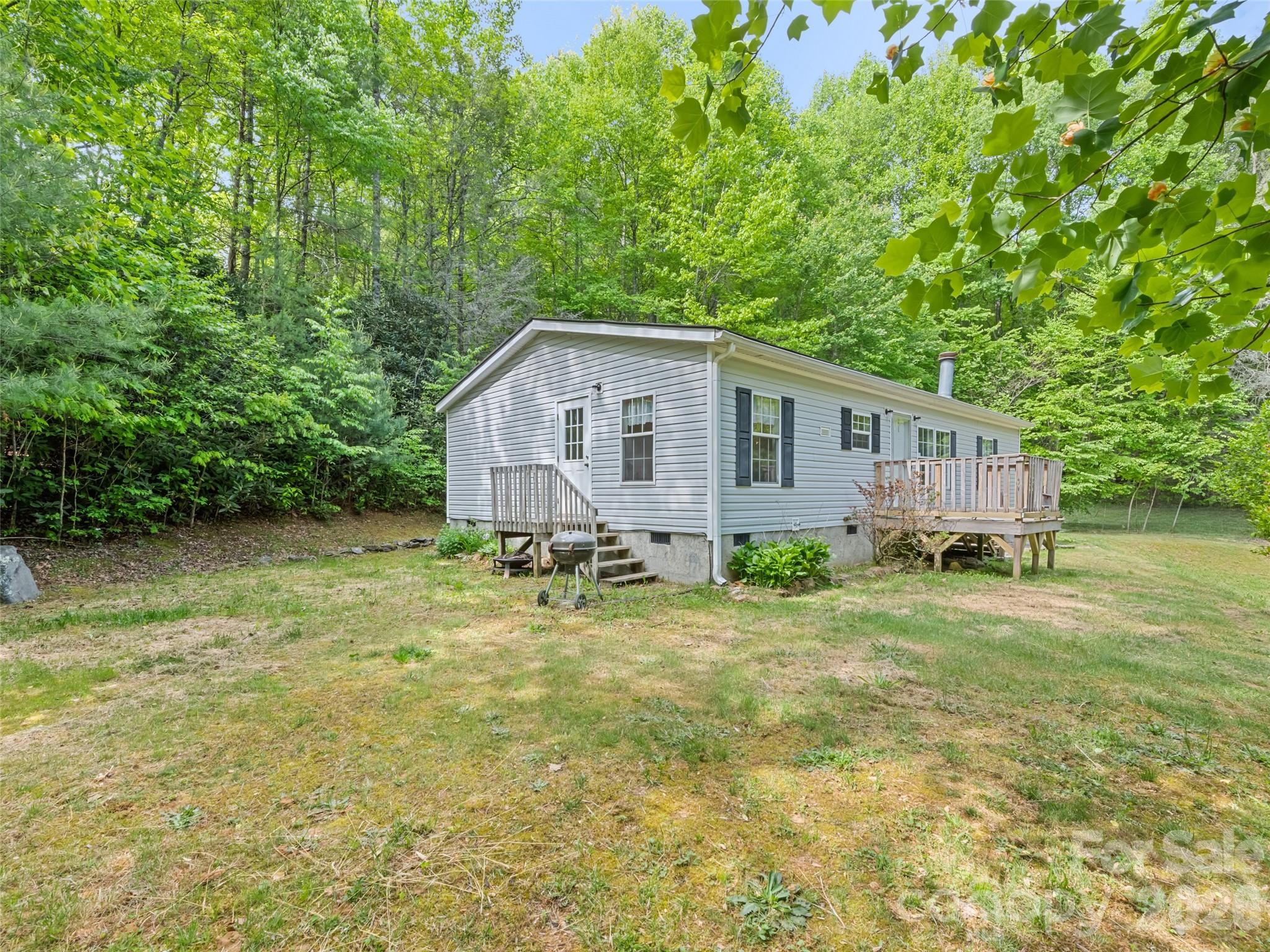 Discover the perfect balance of space and tranquility in this 3 bedroom, 2 bathroom doublewide. Built in 2002 and nestled on a one acre lot, this home offers the privacy you’ve been dreaming of with minimal neighbors and plenty of room to breathe.