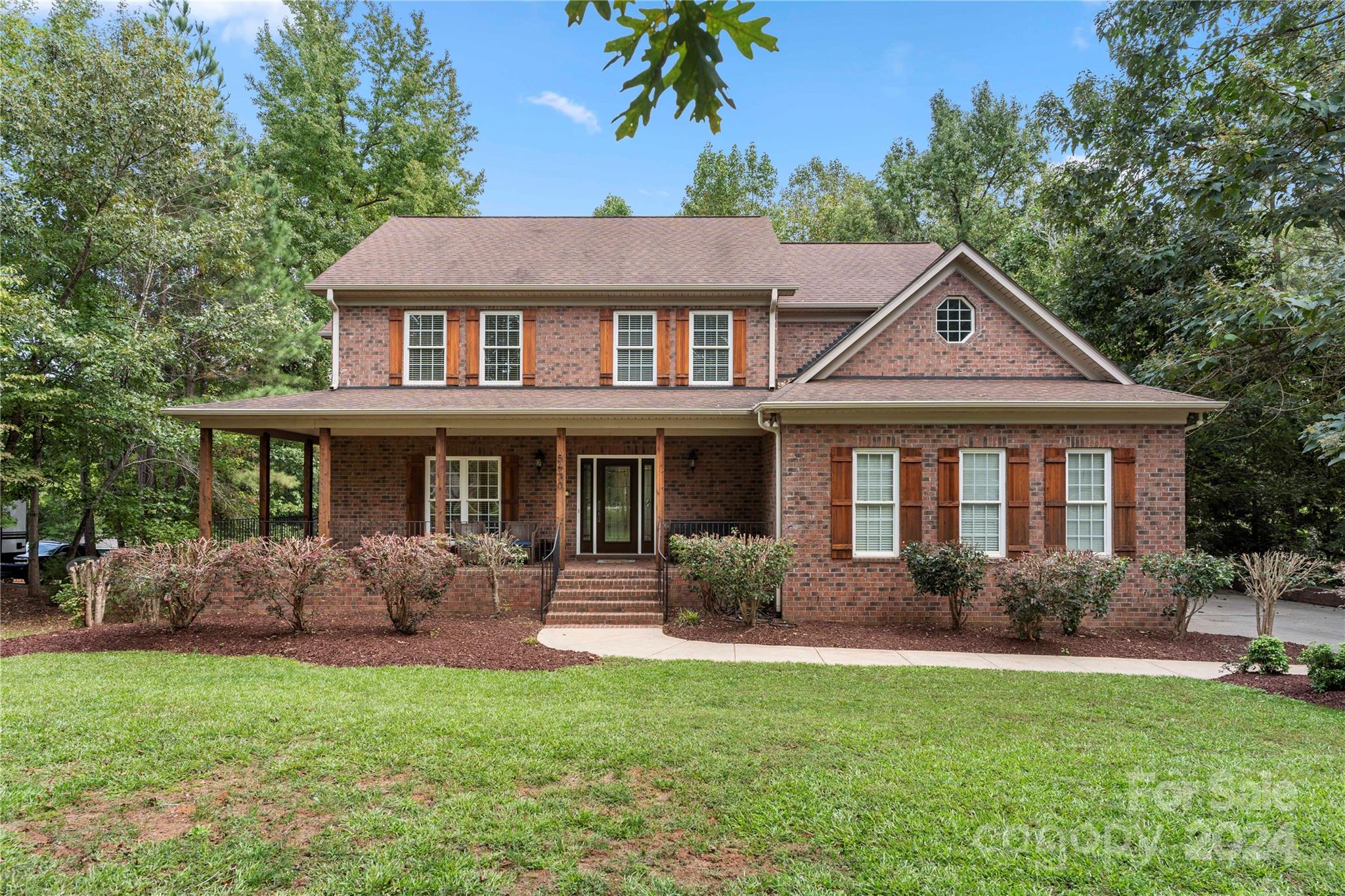 Welcome home to this beautiful custom full brick home with a finished basement (which includes it's own private entry & exit) located in one of the most desirable neighborhoods in Lake Wylie, Masons Crossing. This house is permitted for 5 bedrooms. Septic is permitted for 3 bedrooms. This home comes equipped with quality finishes, mature landscaping & a spacious fenced in backyard that offers additional privacy. Lots of upgrades, new agreeable gray paint throughout interior and new carpet. Relax in your own covered backyard porch besides the cozy double sided fireplace listening to the birds chirp. You may even see some deer. Large backyard is ample enough to put in an inground pool. You will love the peace and tranquility of this location! Masons Crossing is just minutes away from local amenities like shopping, dining, health/fitness centers, hiking, parks, lake activities and Charlotte airport. No HOA & SC low property taxes are a big plus. Award winning Clover schools.