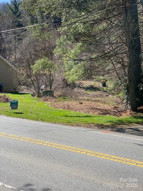 Just over 1 acre, less than 1/2 mile southeast of Sweeten Creek Road! Convenient to everything in South Asheville. Numerous options due to EMP (Employment District) zoning. NCDOT is widening Mills Gap and this lot will be affected. Please refer to attachments.
