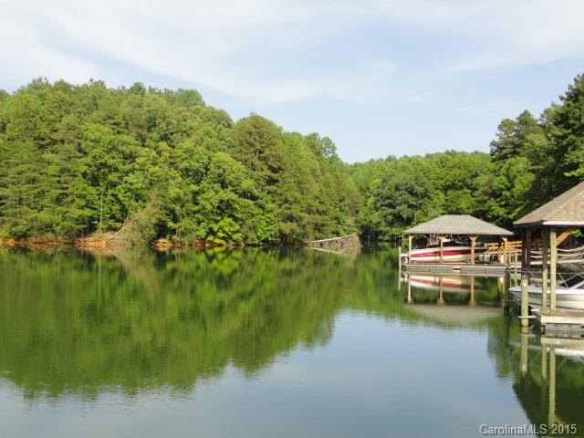 Sprawling WATERFRONT estate on LKN. Upgrades galore! Main level Gourmet Kitchen with Island and Viking range, Formal Dining, Hardwoods, 2-story Great Room with stacked stone fireplace, Office and Living Room.  3 Bedrooms upstairs including Master Suite with Garden Tub. Lower Level Rec Room with fireplace, Wet Bar and Bedroom with Full Bath. Enjoy the views from the Deck & Lower Level Patio, Pier with Dock, Irrigation and Lush Landscape. No Smoking and No Pets. Lawn maintenance is included!