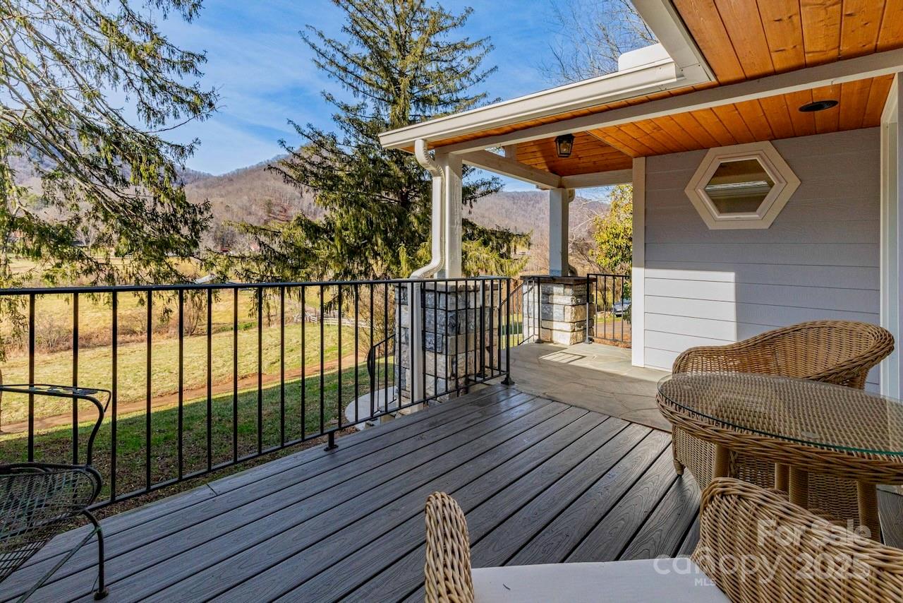 Discover privacy, space, and mountain living with mini-farm potential at 2888 Beaverdam Road
in Canton. Situated well back from the road, this inviting home is surrounded by nature with
two year-round streams, mature spruce pines, a beautifully cultivated garden plot, and a
blueberry patch. 

Enjoy peaceful valley views from the front porch and multiple outdoor living
spaces, including open decks and a screened porch perfect for year-round relaxation. Inside,
the home offers an open floor plan that blends the great room, casual dining area, and kitchen
into one comfortable gathering space. Custom cabinetry, granite countertops, under-cabinet
lighting, a walk-in pantry, and a handy drawer beneath the kitchen sink make this kitchen both
functional and stylish. A gas fireplace adds warmth and ambiance to the main living area. 

The primary suite features a walk-in shower, soaking tub, and generous walk-in closet space. Also, a built-in shelf designed for dining table leaf storage is a feature inside the spacious coat
closet. Additional bedrooms both offer walk-in closets. Other features are a spacious formal
dining room, a hobby area on the lower level with nine built-in bunk spaces. You’ll appreciate the abundant storage throughout, including a countertop for folding laundry and extra cabinetry in the laundry room. 

The home is equipped with thoughtful conveniences such as dual HVAC, lighting in every closet, a hot-water pump system, bidet attachments on all toilets, and a shaft built into the design should a future owner wish to install a dumbwaiter from the garage to the kitchen. 

The property is ideal for those who value both comfort and self-sufficiency. Enjoy well water with a whole-house filtration system, an outside winter shelter for plants, and even a designated shooting range. A rock wall highlights the backyard landscape and adds character to the outdoor setting. 

With its private setting, generous indoor and outdoor living spaces, and an impressive list of amenities, this home offers a rare blend of functionality, nature, and mountain charm—ready for its next owner to enjoy!