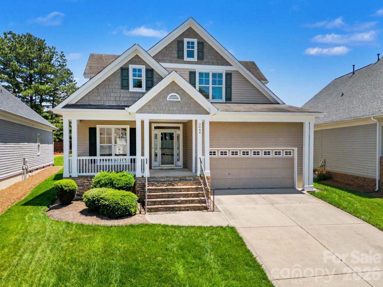 BEAUTIFUL SPACIOUS 2-STORY CRAFTSMAN STYLE HOME—Located in the exclusive Chatham subdivision adjacent to Tradition Golf Course. Featuring 3 bedrooms, 2.5 bathrooms, and huge bonus room which could easily function as a 4th bedroom! Almost 2,700 square feet of living space. The main level presents a formal dining room, half bath, laundry room, kitchen, and a spacious 2-story great room. The primary bedroom is on the first floor and has a private, ensuite full bathroom with dual vanity, separate tub/shower and walk in closet. The upper level offers 2 bedrooms, full bath, large bonus room with attached office/study. Several attic walk-in areas that offer even more storage space. Spacious 2-car garage. Large front porch, rear deck, and nicely landscaped yard—The perfect home to relax and entertain! Convenient to both I-85 and I-485 making for an easy commute to the University Area, Concord Mills, and Uptown Charlotte. This home offers the perfect blend of timeless charm and modern comfort just moments from the neighborhood's beloved restaurants, coffee shops, parks and boutiques. Come see this amazing home today!