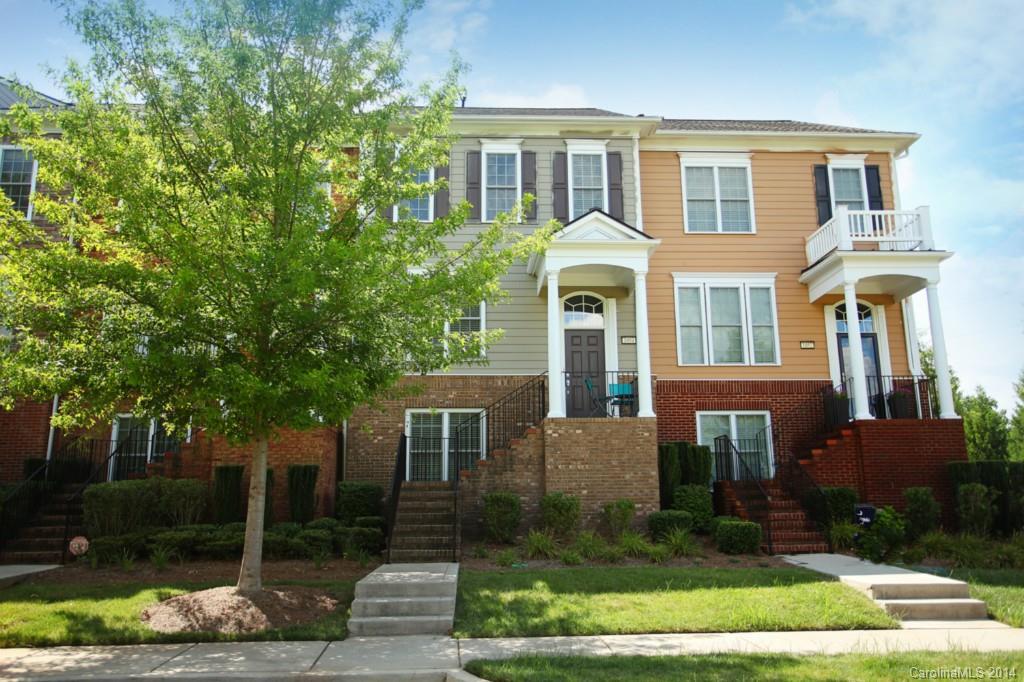 This is a Must See Townhome! Gorgeous 4 BD 3.5 BA TH with a modern flair! Featuring:  dark hardwoods, rich cabinetry, wainscoting, security and more. Great Room with gas fireplace opens to Chef’s Kitchen with work island, Bkfast Bar, granite & GE SS Appliances.  Private Deck offers outdoor dining. Front Porch overlooking tree lined streets, across from park. Awesome community with walking trails, close to I-77, schools, library, YMCA, and medical facilities.  Great Fort Mill Schools!